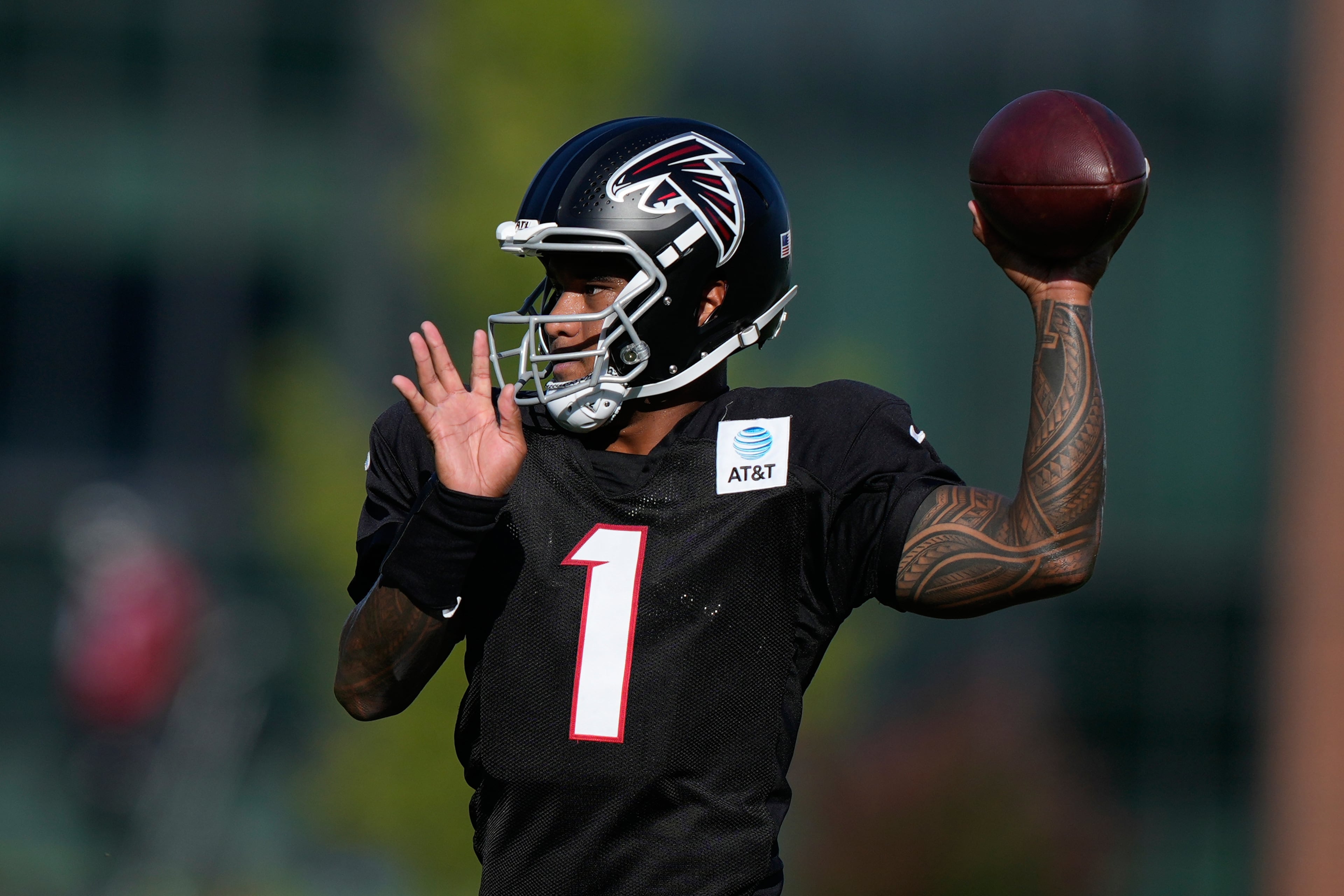 Atlanta Falcons quarterback Tua Tagovailoa runs drills during an NFL football training camp practice on Monday in Flowery Branch. (Brynn Anderson/AP)