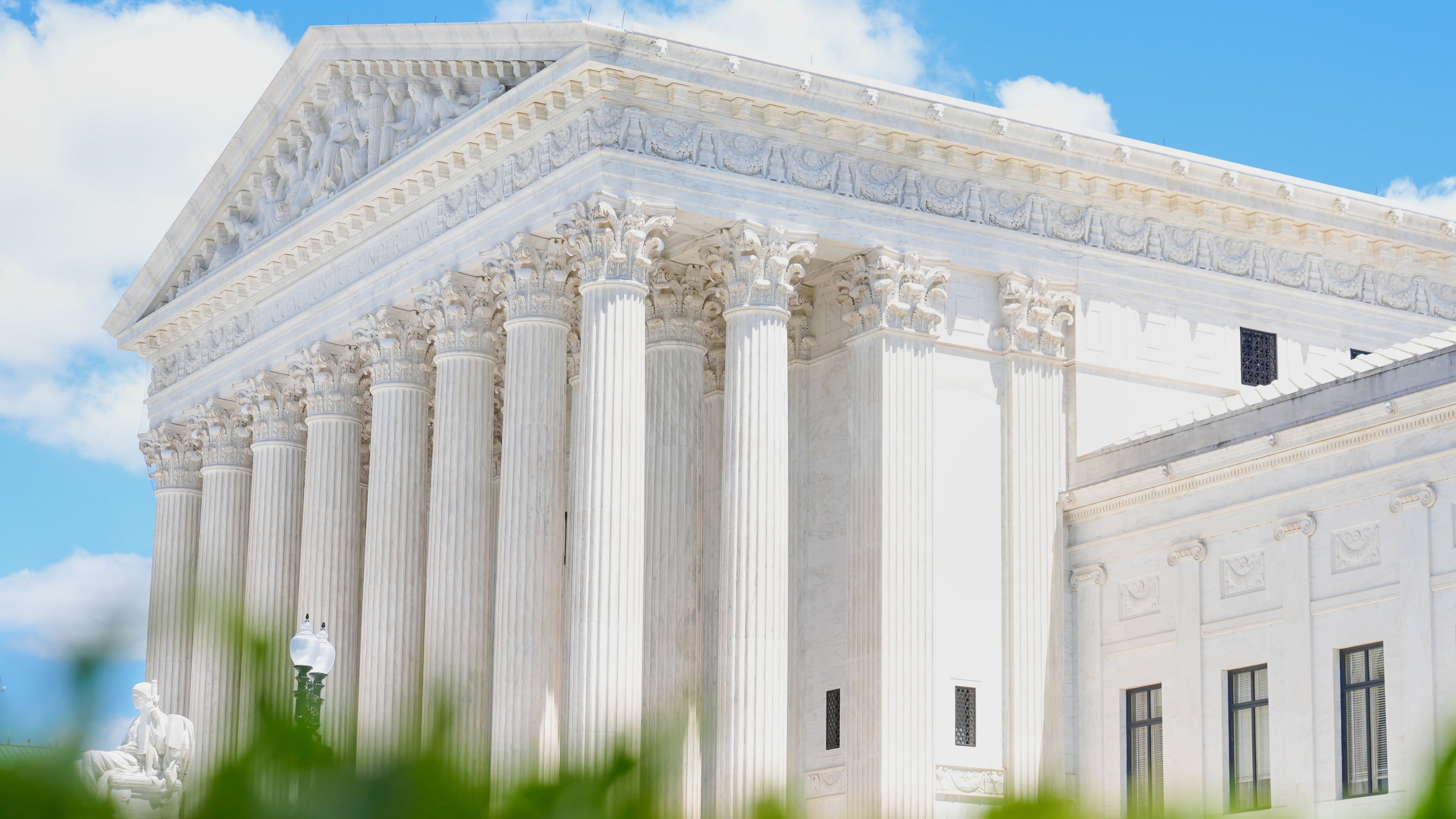 A statue titled the "Authority of Law" sits in front of the Supreme Court on Friday, May 15, 2026, in Washington. (AP Photo/Mariam Zuhaib)