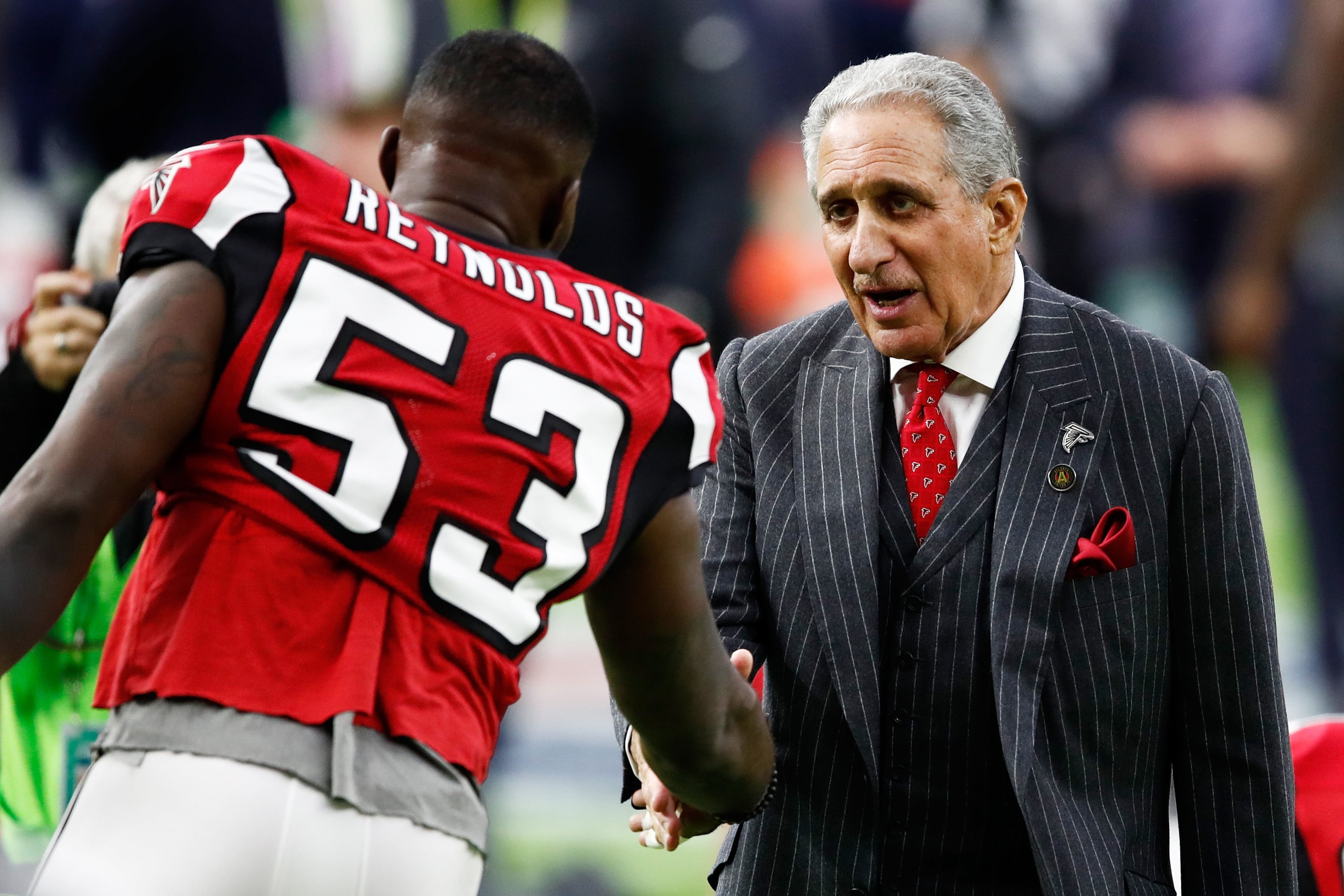 HOUSTON, TX - FEBRUARY 05: LaRoy Reynolds #53 of the Atlanta Falcons and team owner Arthur Blank speak prior to Super Bowl 51 at NRG Stadium on February 5, 2017 in Houston, Texas. (Photo by Gregory Shamus/Getty Images)
