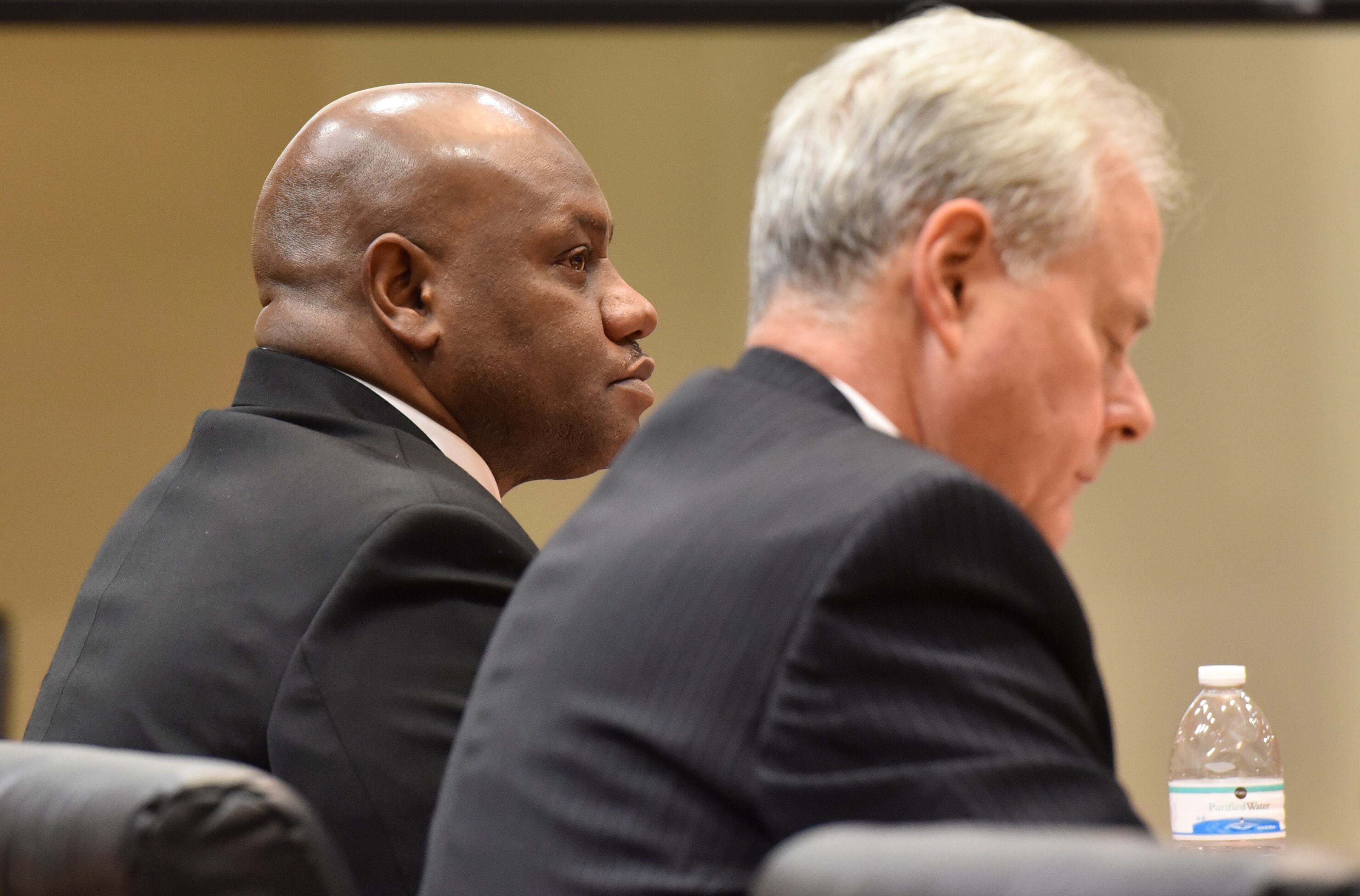Feb. 18, 2016 Decatur, GA: Former DeKalb County Police Sgt. Anthony Remone Robinson, left, listens to testimony against him Thursday in DeKalb County Superior Court. Robinson was charged with ordering the beating of a burglary suspect. (UPDATE: On Friday, Feb. 26, Robinson was found guilty on six counts but avoided conviction on the most serious charges.) BRANT SANDERLIN/BSANDERLIN@AJC.COM