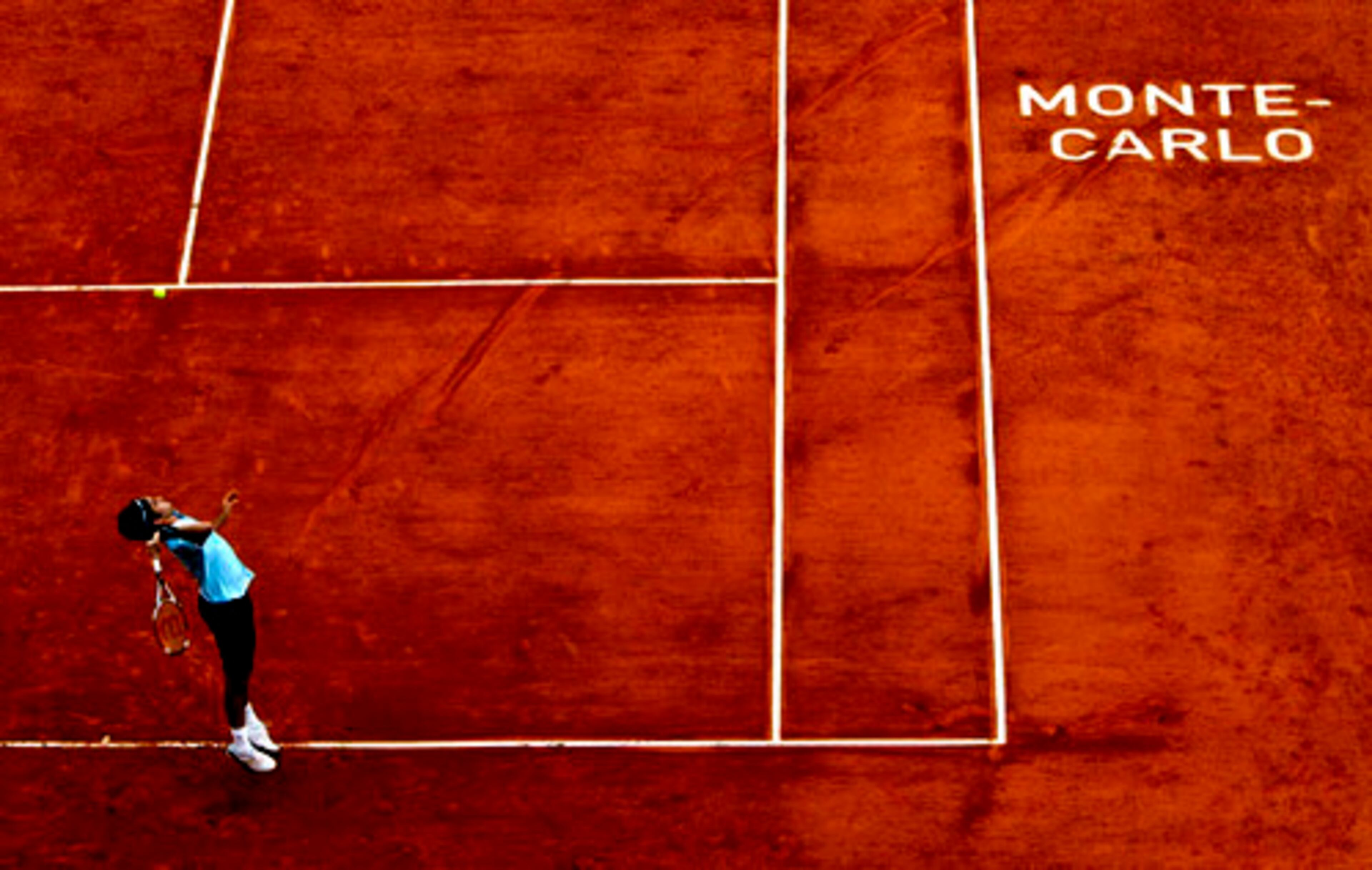 Swiss player Roger Federer serves the ball to Ruben Ramirez Hidalgo of Spain during their second round match of the Monte Carlo Tennis Open tournament in Monaco, on Wednesday.