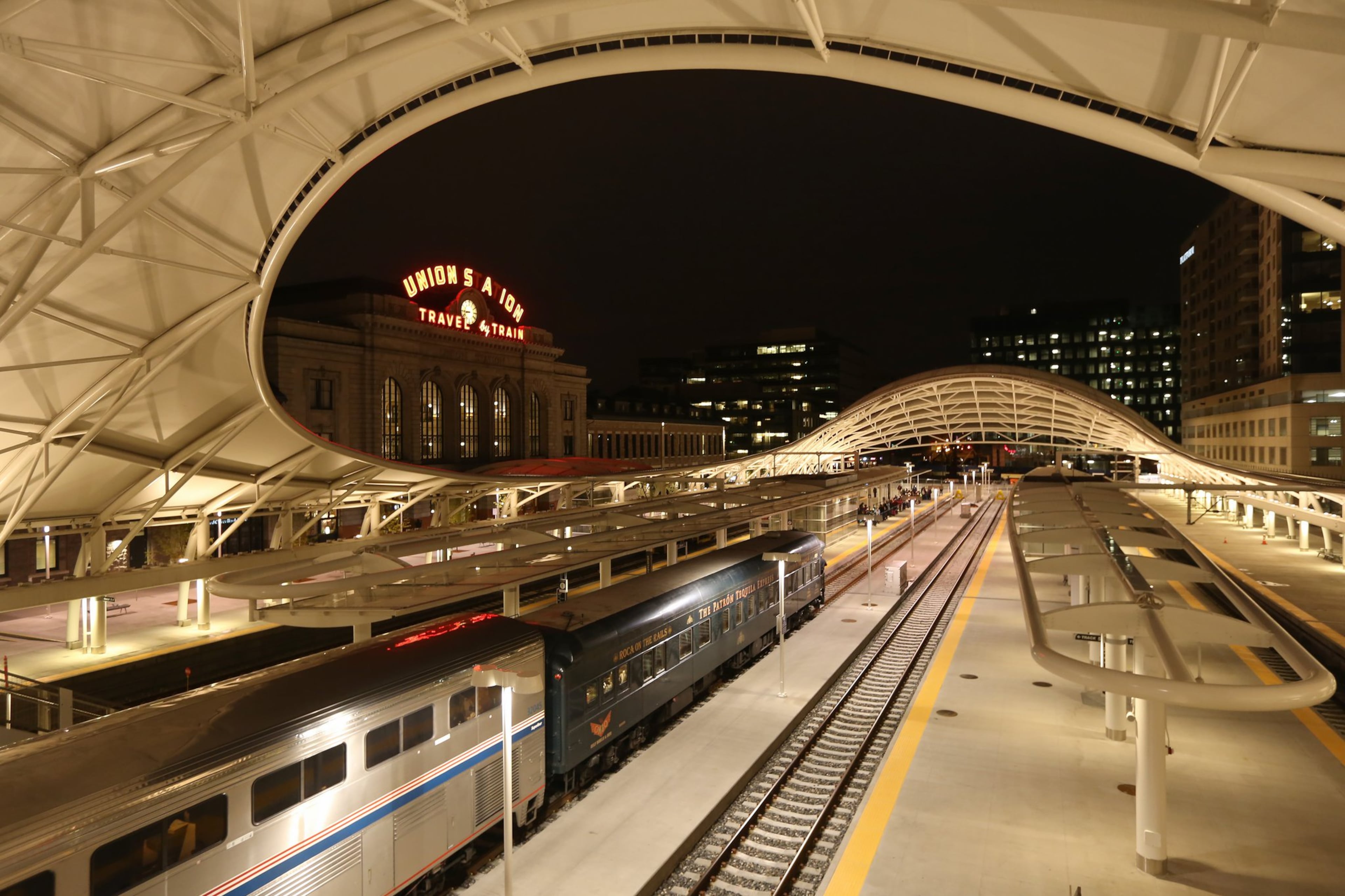 An AMTRAK train rolls into Union Station, a huge, multi-modal station in Downtown Denver that also connects with commuter trains and buses. Ben Gray/AJC File)