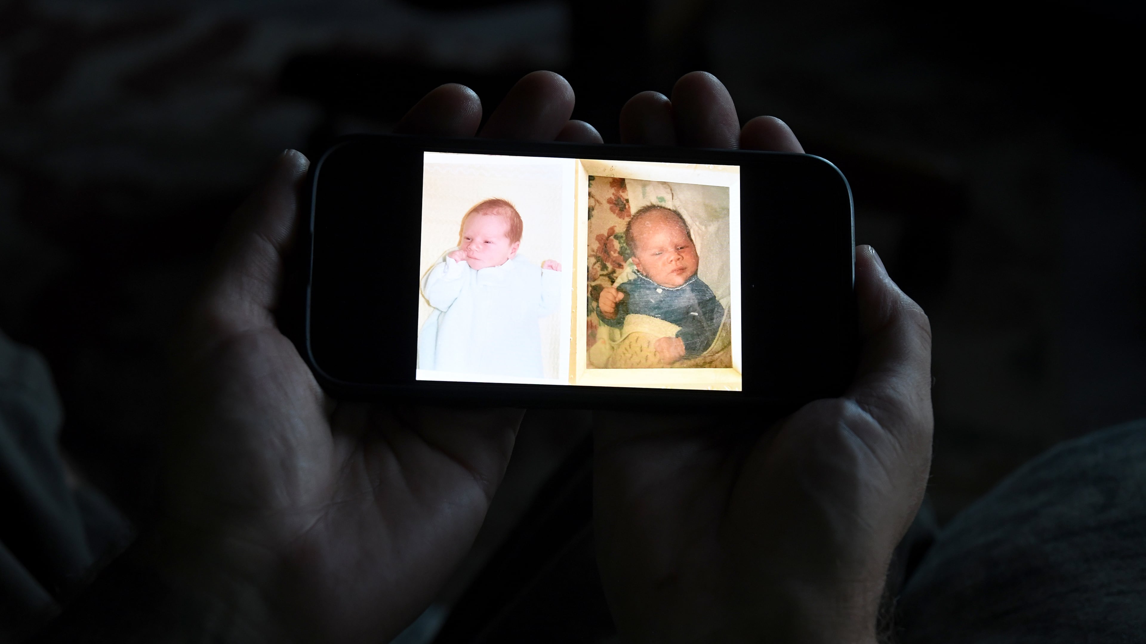 Jeremy Morrison, who says he was sent home with the wrong parents after he was born, shows what he believes is a baby photo of him, left, and of the other baby he says was switched at birth while recounting the story at his home in Colorado City, Colo., on Thursday, July 16, 2026. (AP Photo/Thomas Peipert)