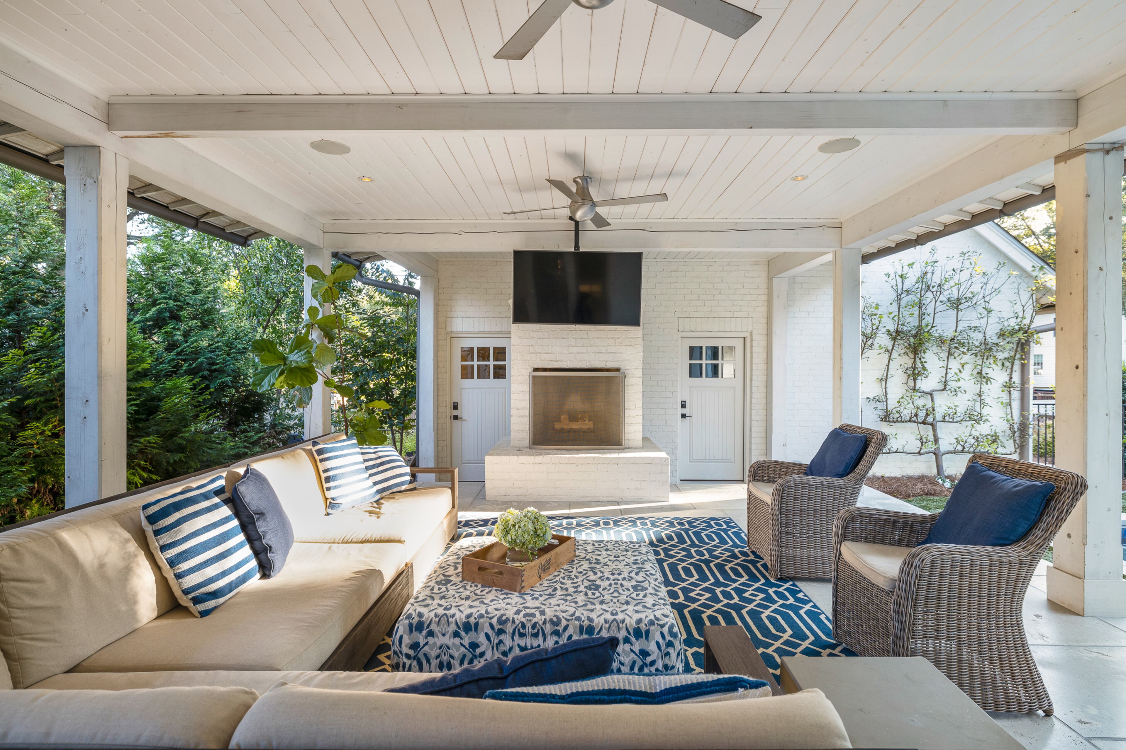 Stay warm under the covered patio in front of the fireplace.