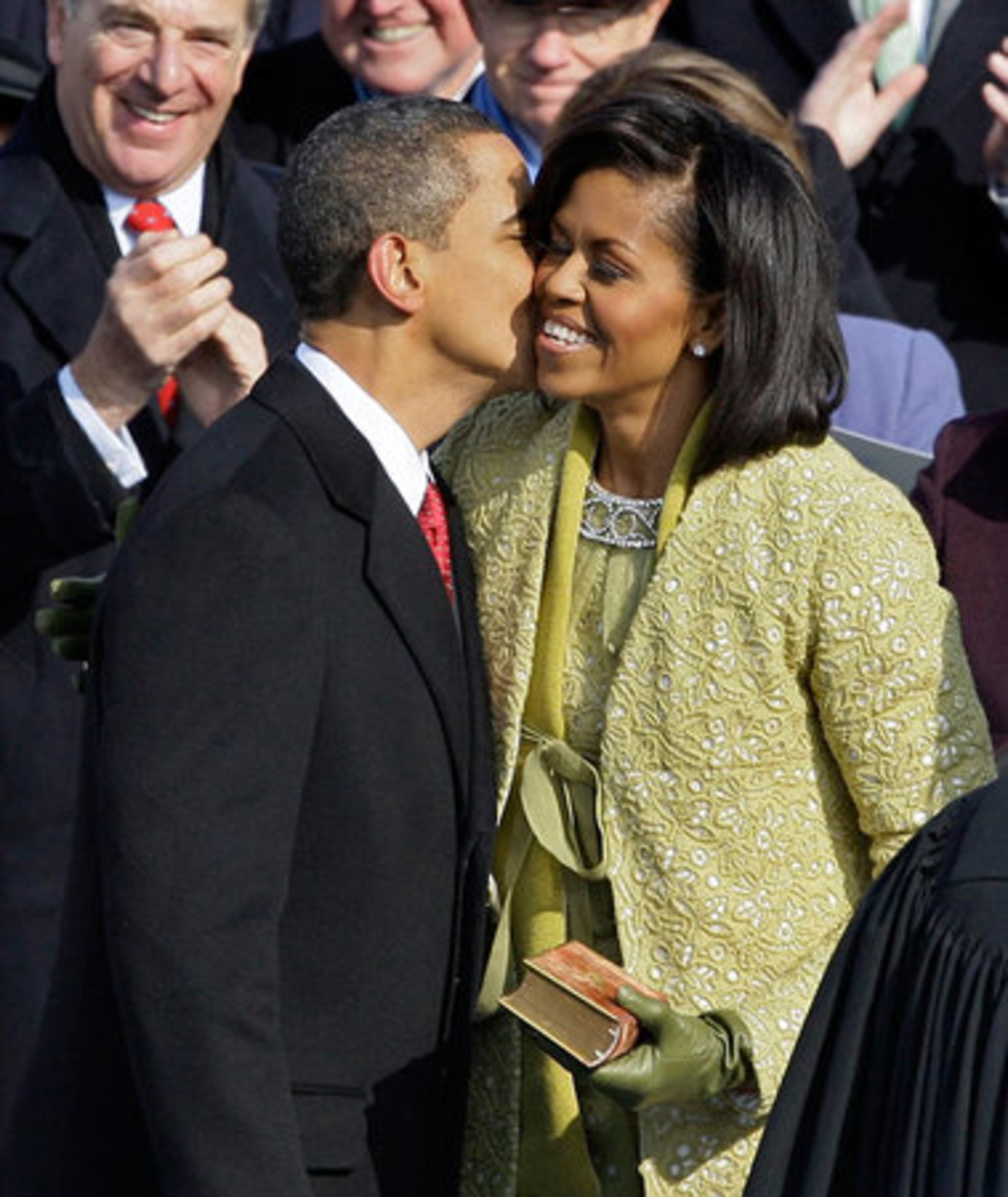 Obama kisses his wife, Michelle, after taking the oath of office.
