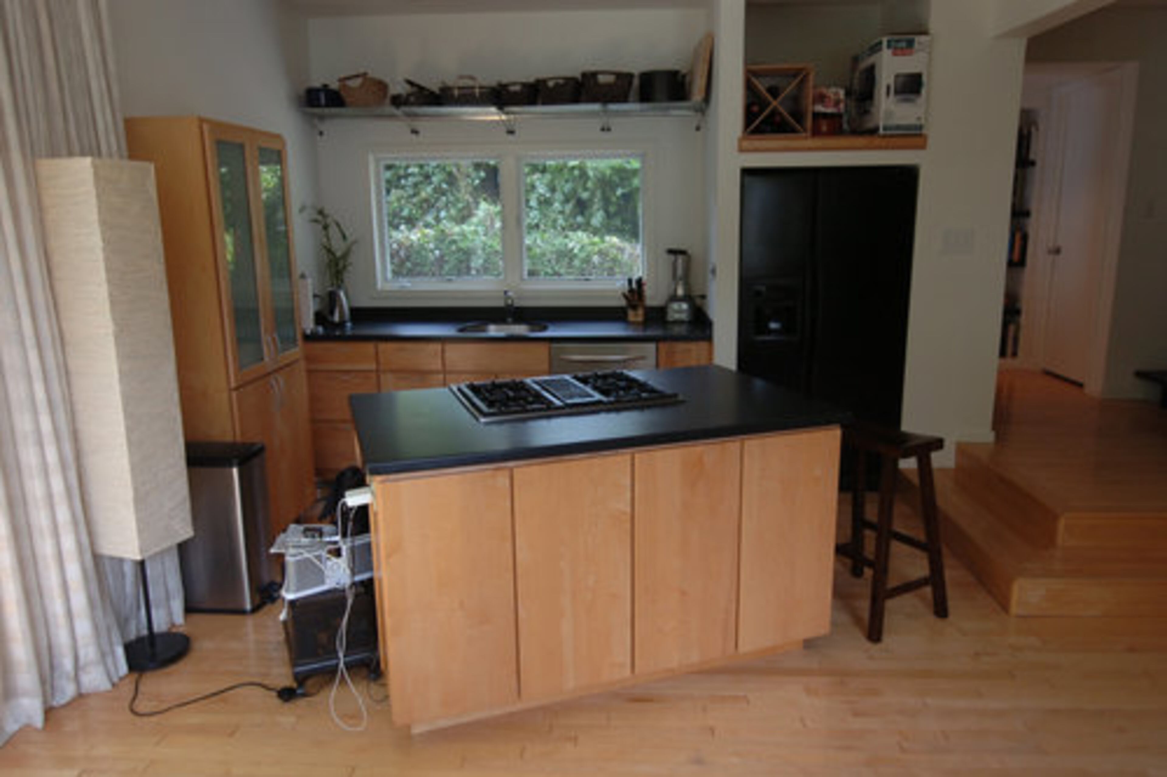 An angled island divides the cooking area and pantry.
