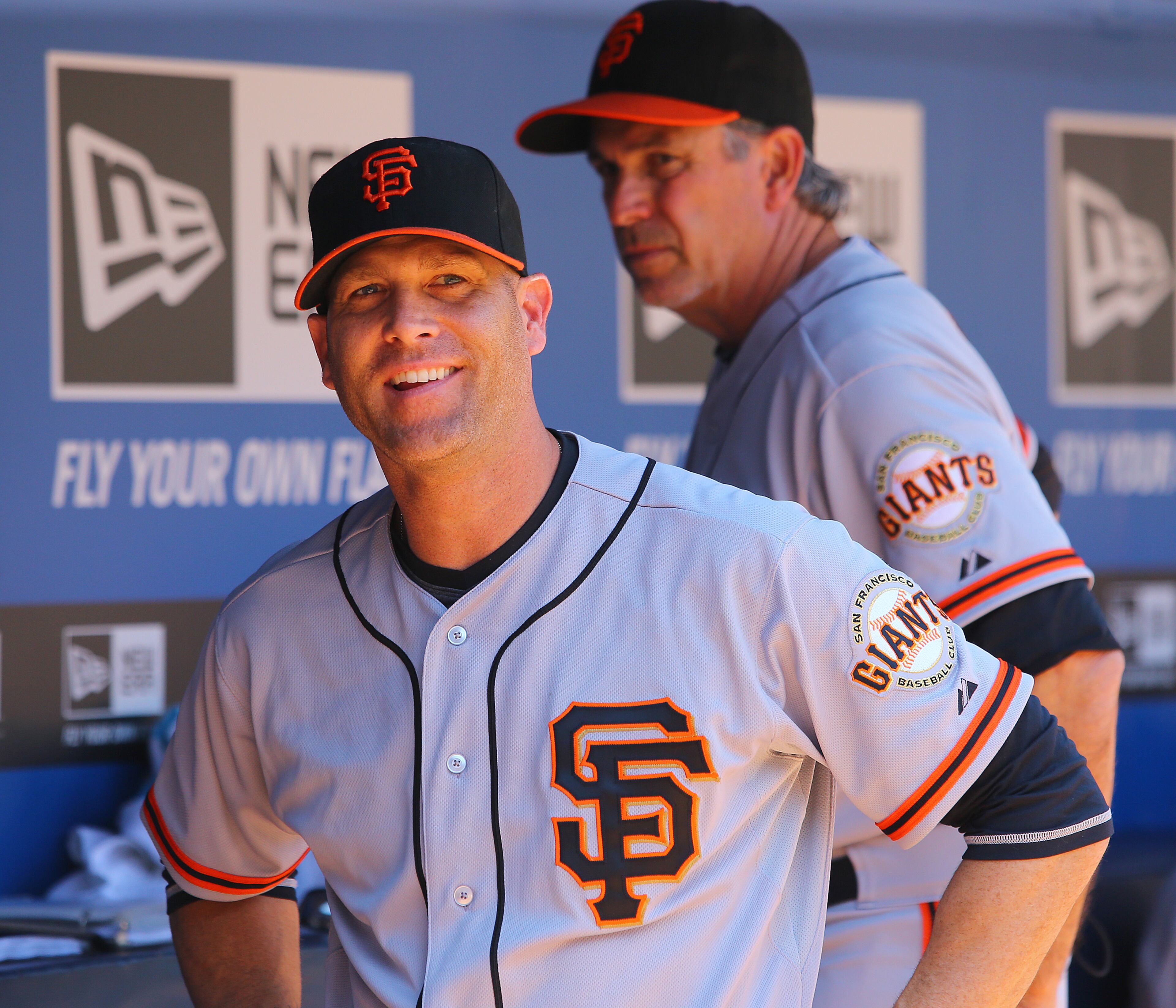 Former Braves pitcher Tim Hudson looks out of place in a Giants uniform in the visitors dugout before the finale of a three-game set against the Braves on Sunday, May 4, 2014, in Atlanta. CURTIS COMPTON / CCOMPTON@AJC.COM