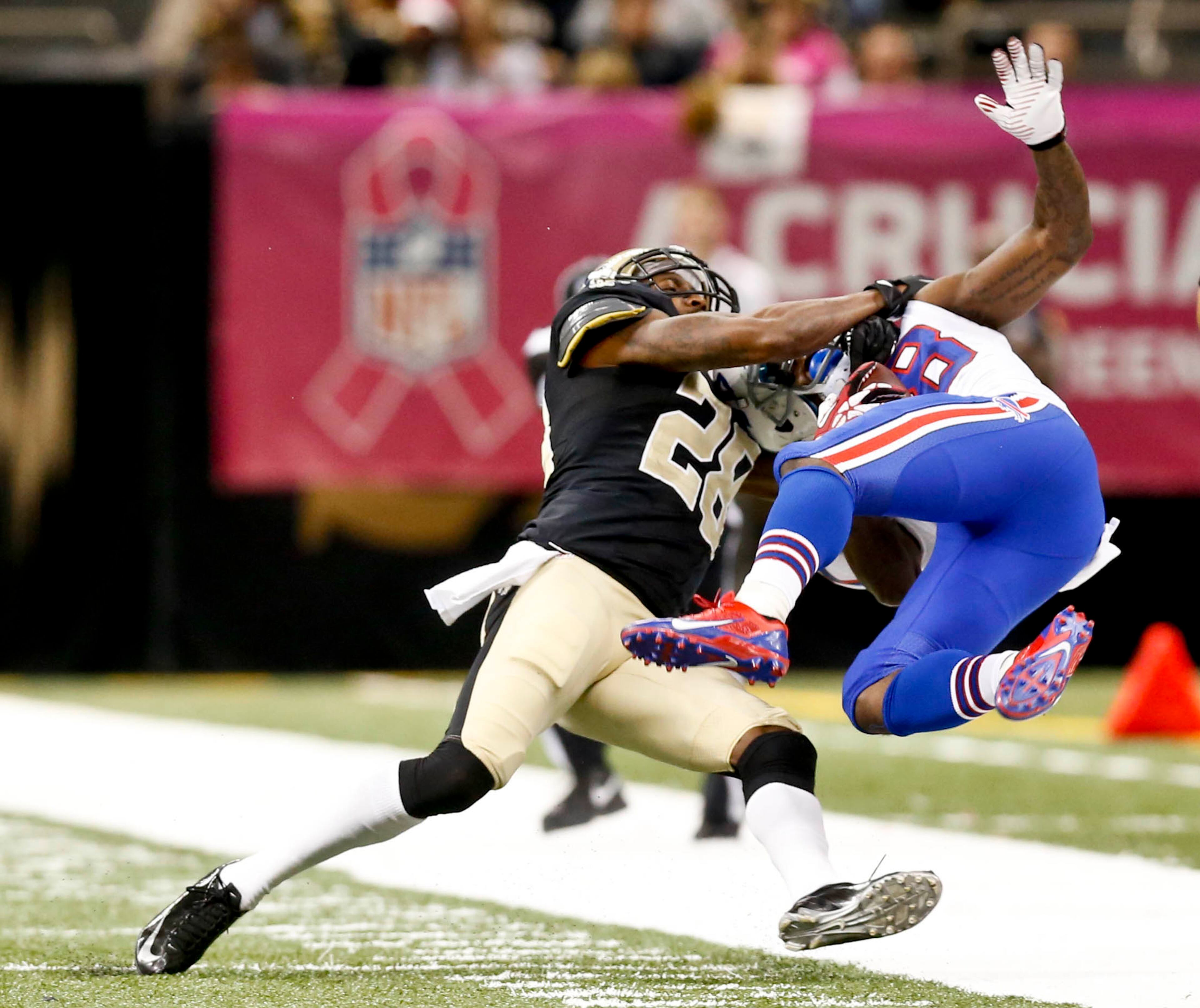 New Orleans Saints cornerback Keenan Lewis (28) tackles Buffalo Bills wide receiver Marquise Goodwin (88) during the second half of a game at Mercedes-Benz Superdome. The New Orleans Saints defeated the Buffalo Bills 35-17. Mandatory Credit: Derick E. Hingle-USA TODAY Sports