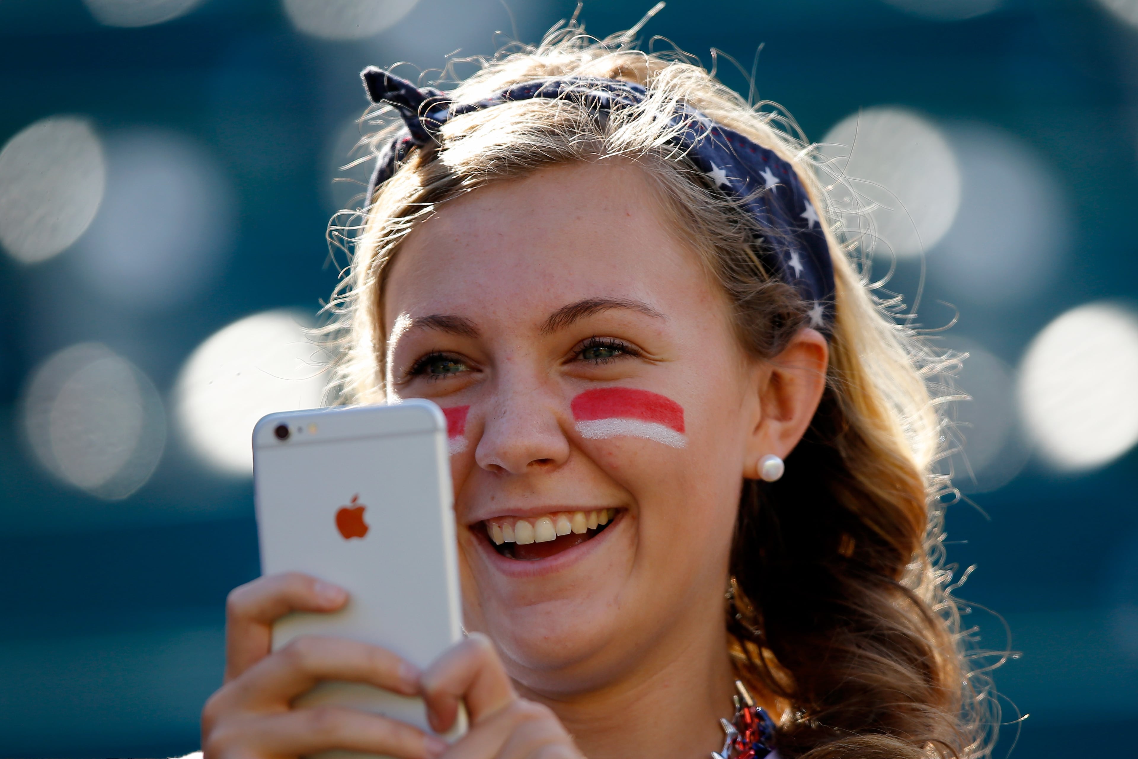 EDMONTON, AB - JUNE 22: A fan of the United States takes a picture with her IPhone before the USA takes on Colombia in the FIFA Women's World Cup 2015 Round of 16 match at Commonwealth Stadium on June 22, 2015 in Edmonton, Canada. (Photo by Kevin C. Cox/Getty Images)