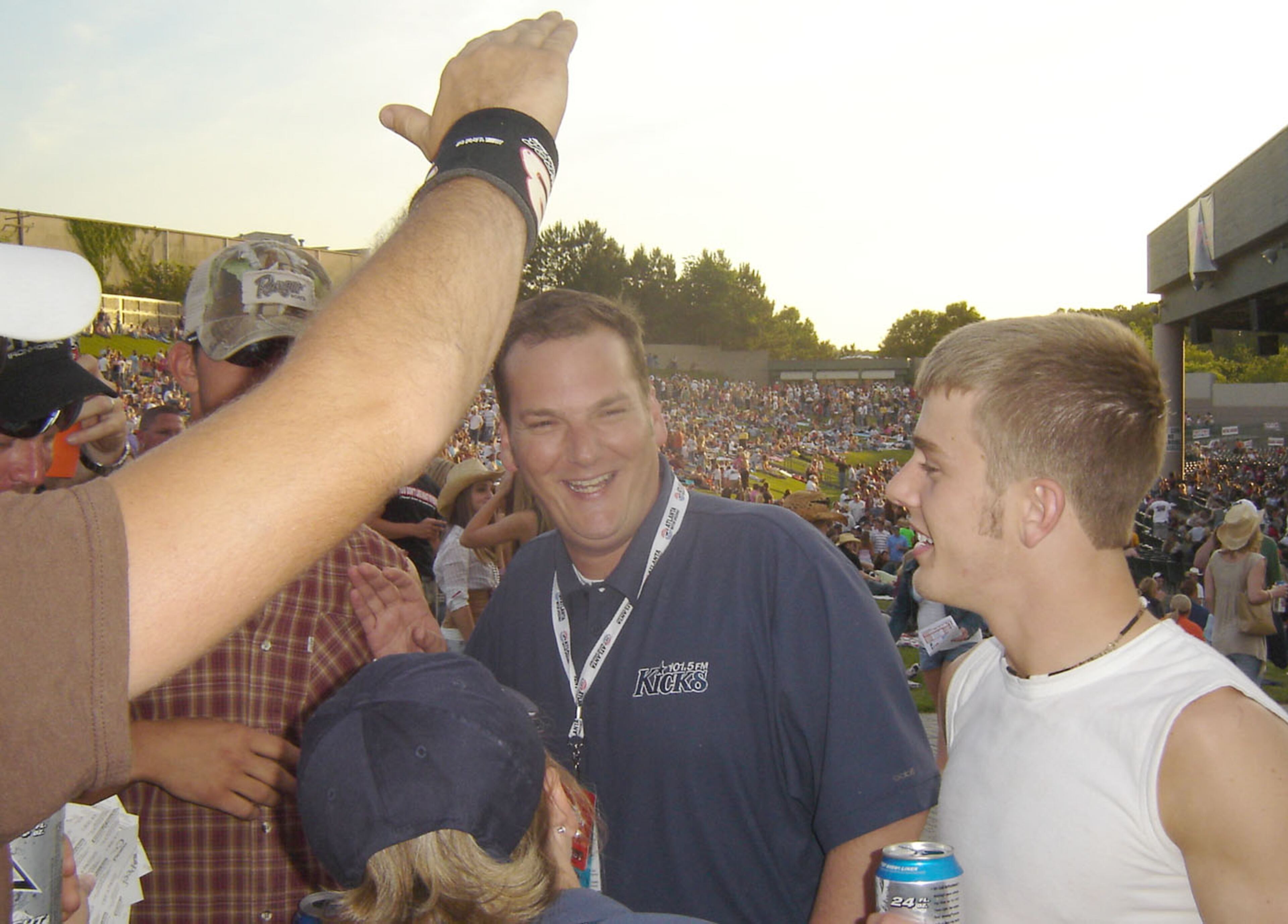 New Kicks 101.5 morning host Cadillac Jack (center) hobnobs with fans including Kyle O'Kelley, 21, of Jackson (right) at Country Fair 2006 Friday night. (Rodney Ho/AJC)