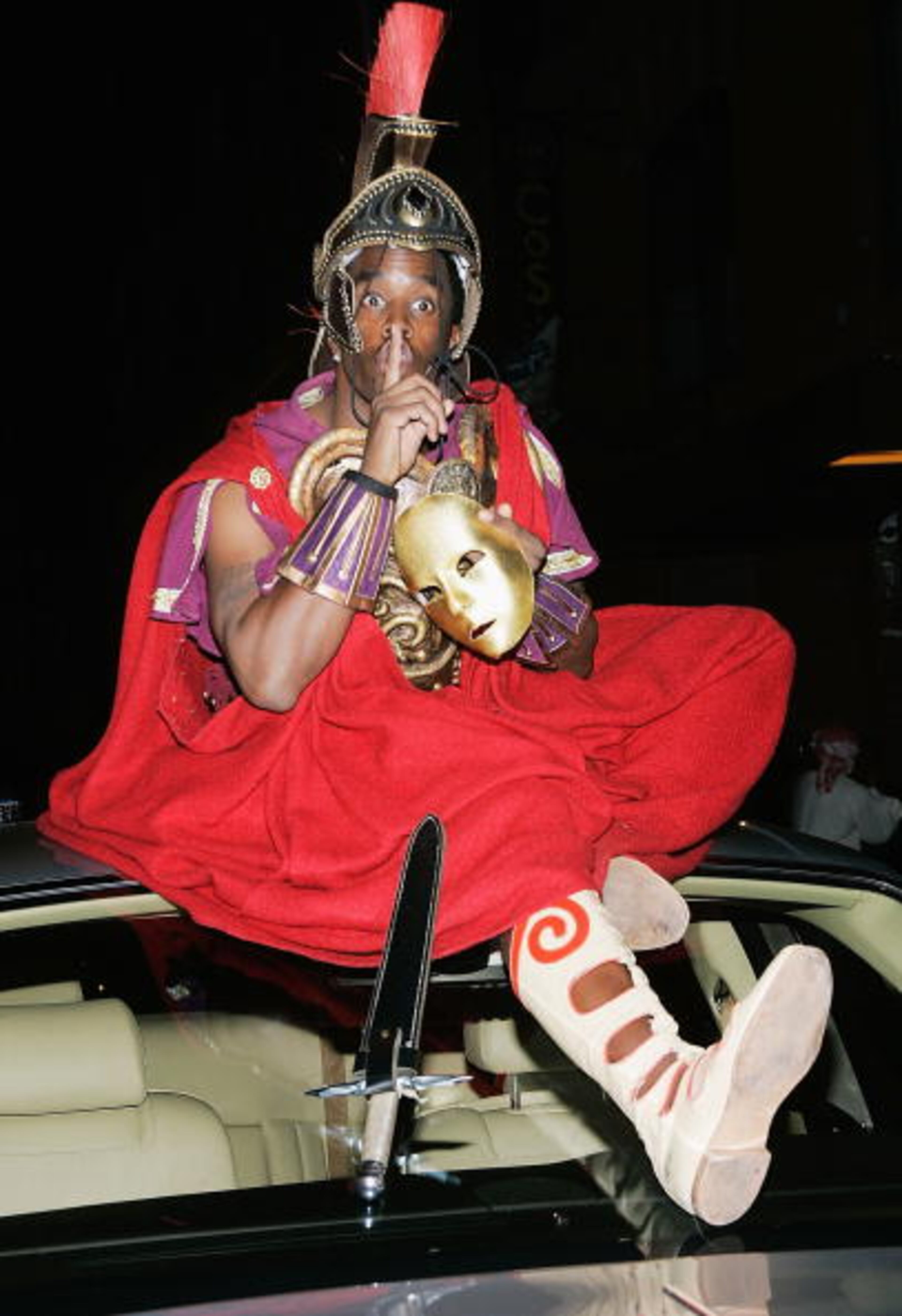 Rapper/producer Sean "P. Diddy" Combs sits on top of his Rolls Royce as he attends singer Mariah Carey's Halloween party at Cain October 31, 2004 in New York City. (Photo by Evan Agostini/Getty Images)