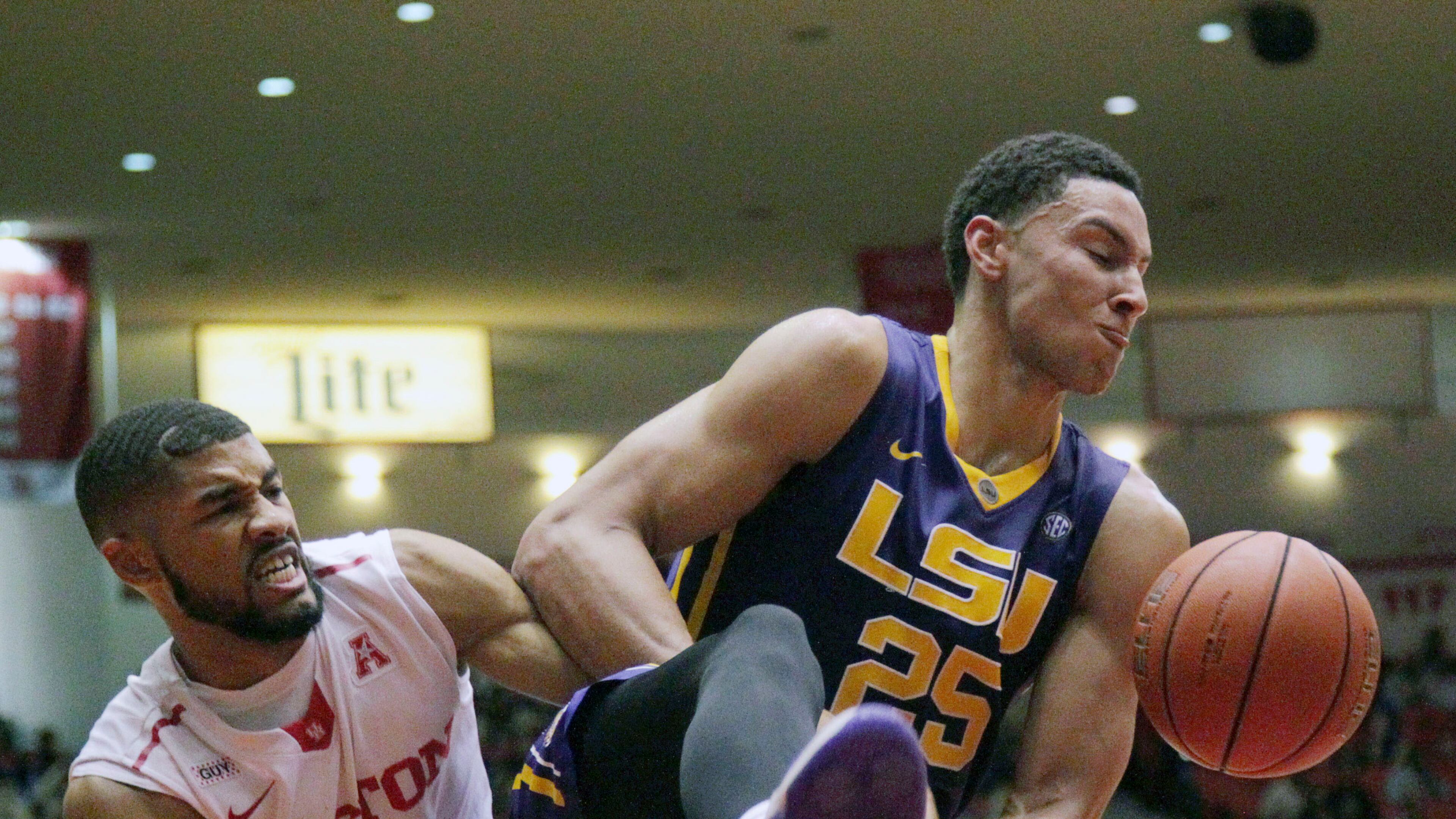LSU forward Ben Simmons (25) gets the ball from Houston guard LeRon Barnes (4) during the second half of an NCAA college basketball game at Hofheinz Pavillion Sunday, Dec. 13, 2015, in Houston. (Jon Shapley/Houston Chronicle via AP) MANDATORY CREDIT