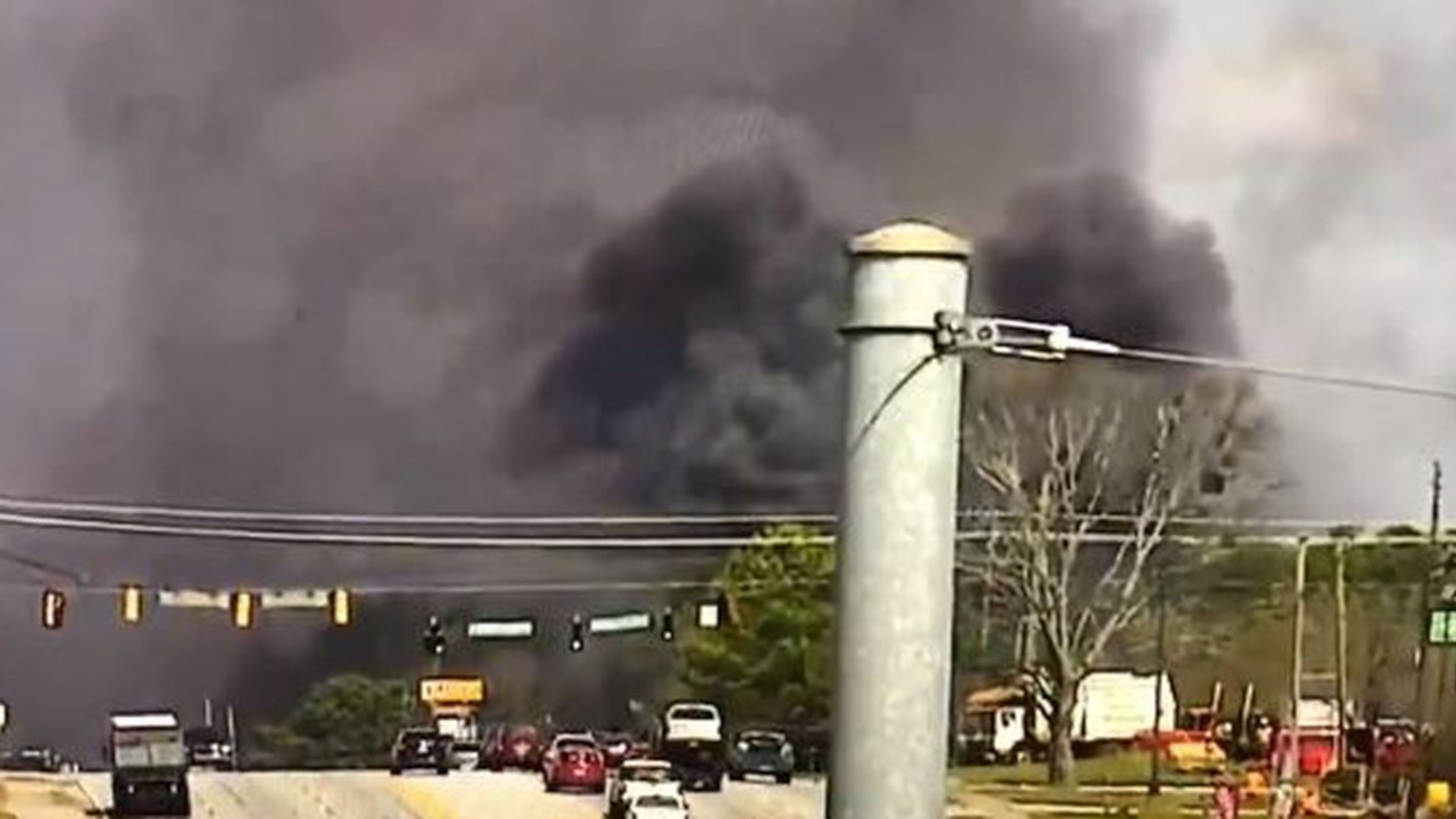 The blaze sent large plumes of black smoke over South Cobb Drive near Pat Mell and Austell roads.