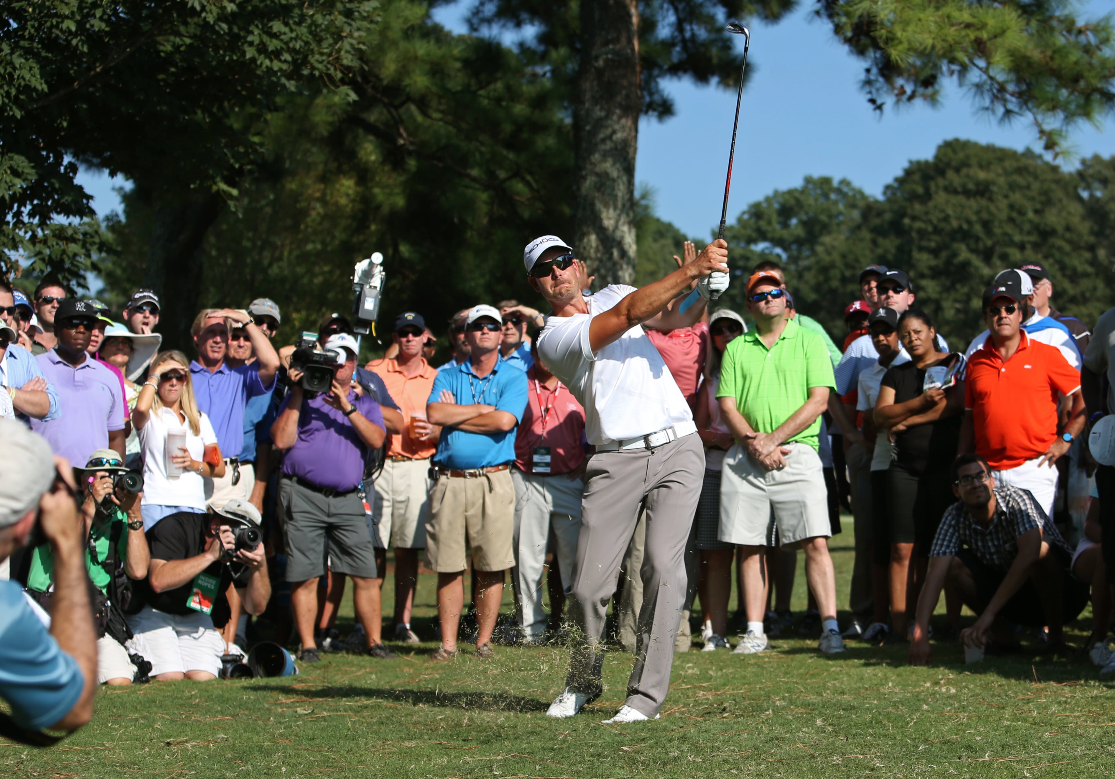 Henrik Stenson follows through on his second shot on the No. 14 rough during round one of the 2013 Tour Championship at East Lake Golf Club Thursday morning in Atlanta, Ga., September 19, 2013. Stenson finished 1st with a round of 6 under par.