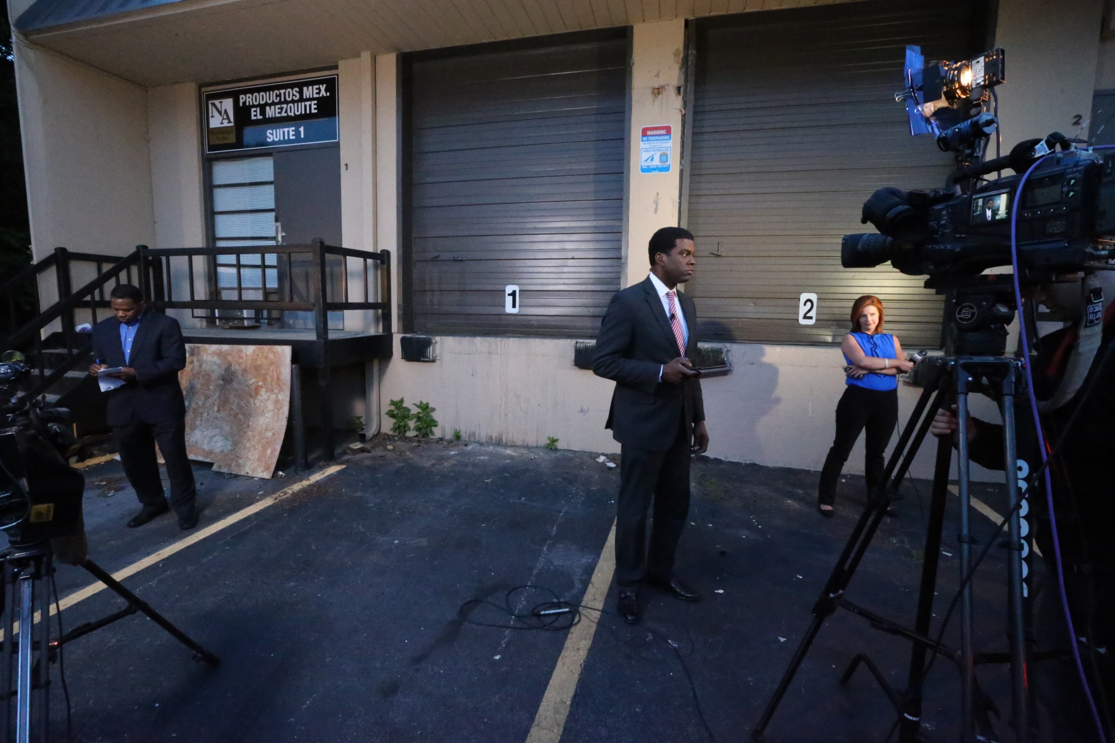 The press arrive at the scene where police seized more than $6 million worth of cocaine, weapons and cash during a pair of overnight south Fulton County drug raids. JOHN SPINK/JSPINK@AJC.COM