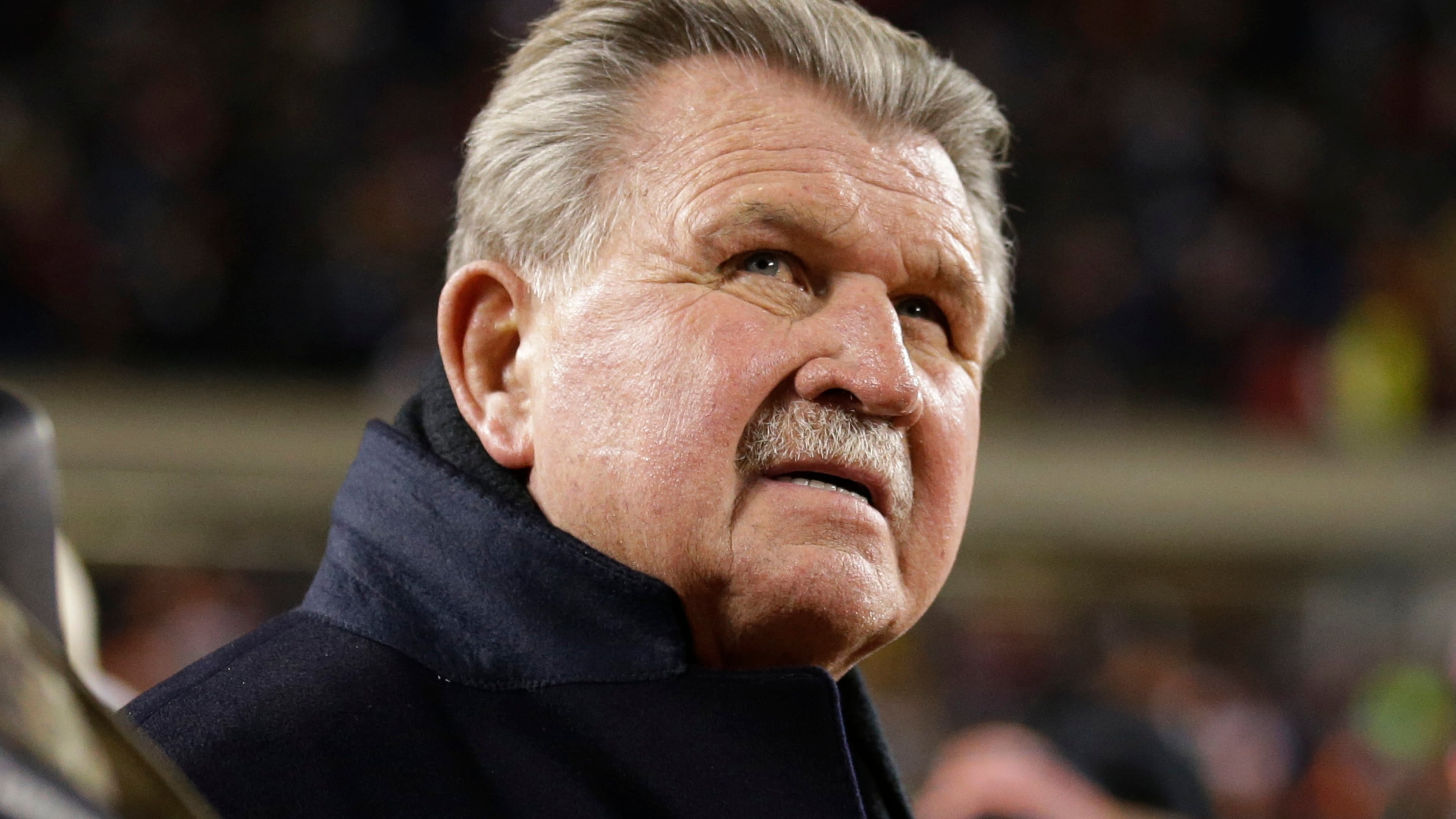 FILE - Former Chicago Bears player and football coach Mike Ditka waits for the halftime ceremony where his No. 89 was to be retired by the Bears during an NFL football game between the Bears and the Dallas Cowboys, Monday, Dec. 9, 2013, in Chicago. (AP Photo/Nam Y. Huh, File)
