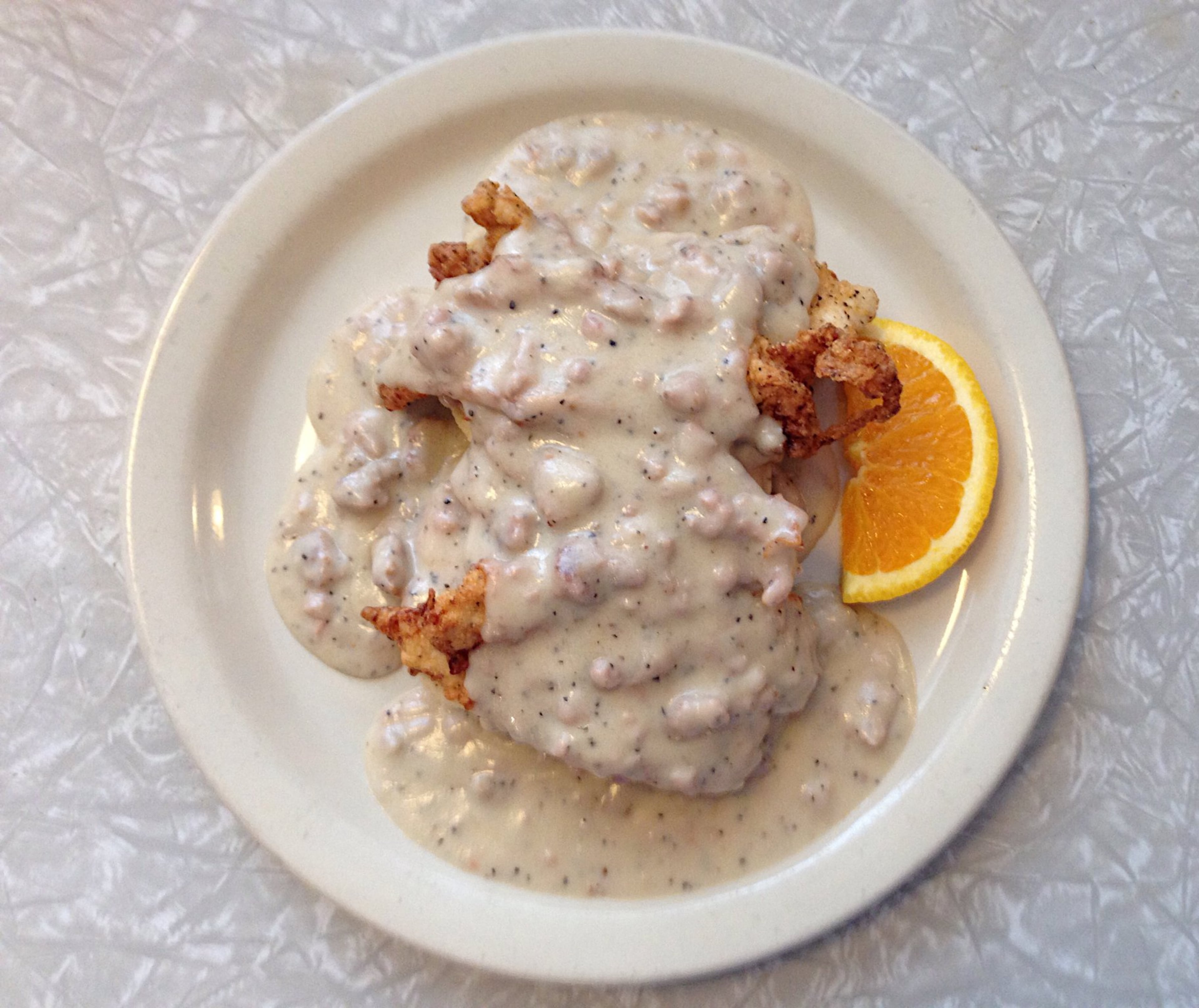 The Comfy Chicken Biscuit at Home Grown consists of fried chicken tenders and sausage gravy on open-faced biscuits. CONTRIBUTED BY WYATT WILLIAMS