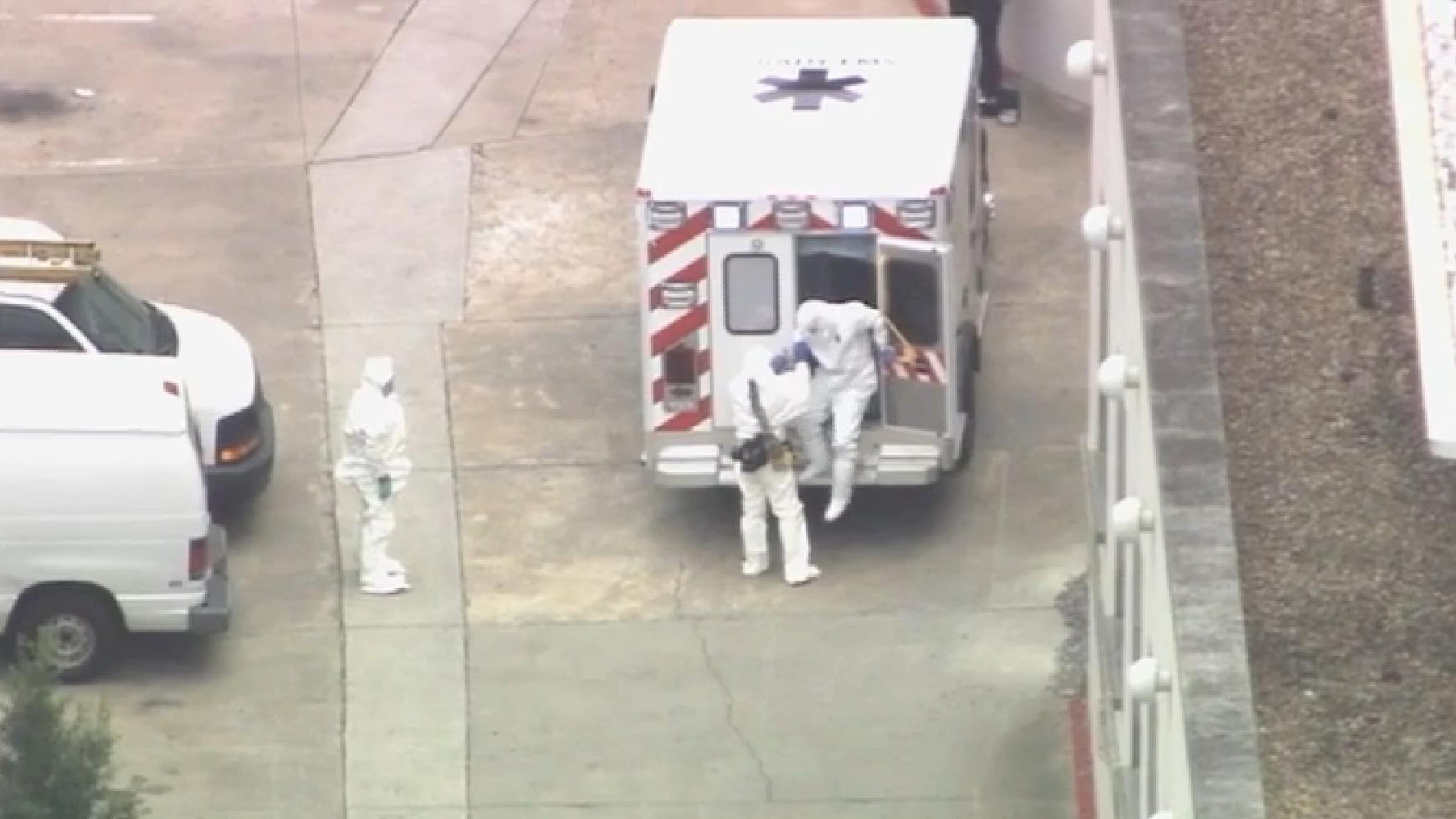 An ambulance arrives with Ebola victim Dr. Kent Brantly, right, to Emory University Hospital, Saturday, Aug. 2, 2014, in Atlanta. Brantly, infected with the Ebola virus in Africa arrived in Atlanta for treatment Saturday, landing in a specially equipped plane at a military base, then being whisked away to one of the most sophisticated hospital isolation units in the country, officials say.