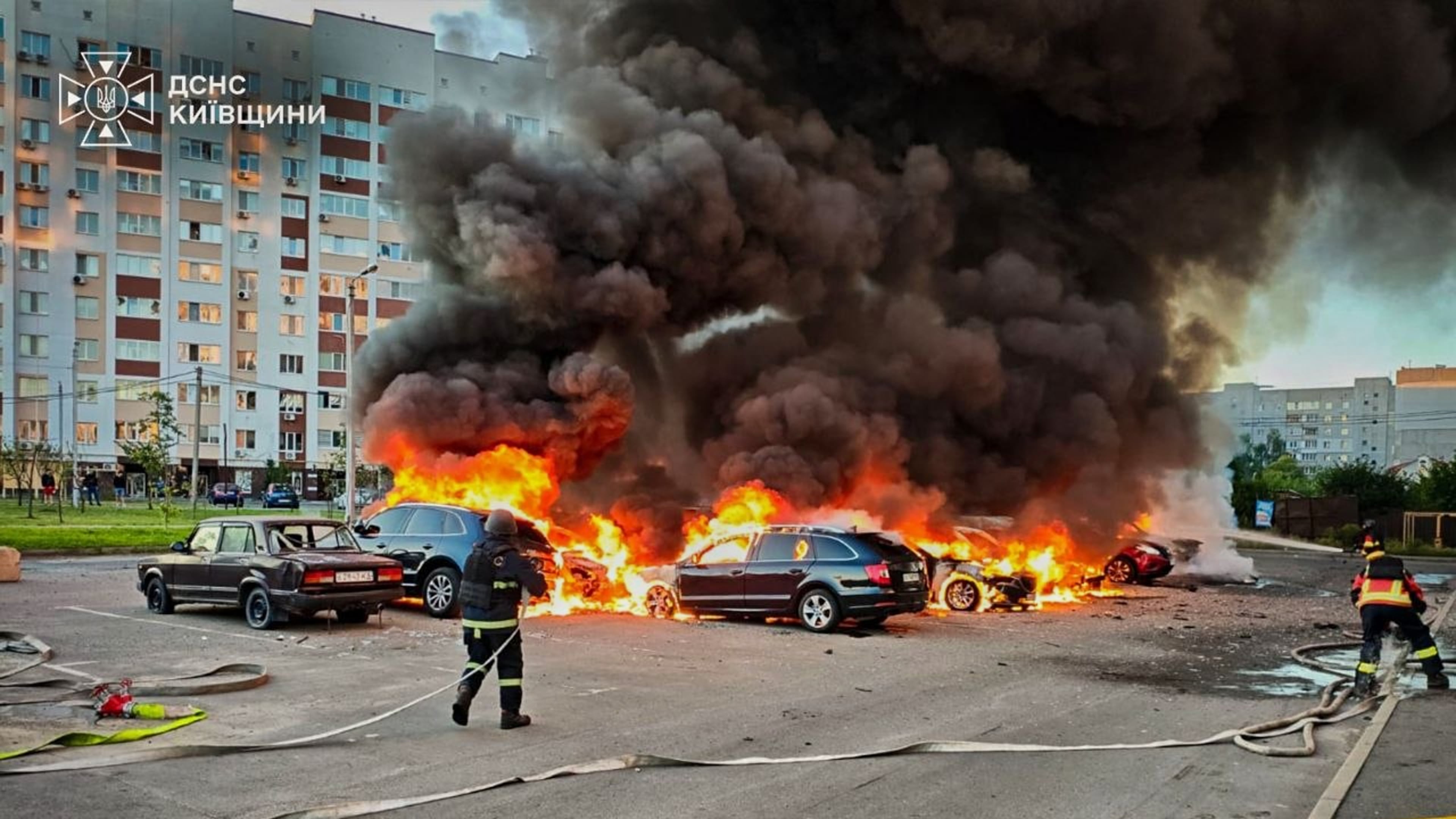 In this photo provided by the Ukrainian Emergency Service, cars burn as firefighters try to put out a fire following a Russian drone attack in Kyiv region, Ukraine, Friday, Aug. 28, 2026. (Ukrainian Emergency Service via AP)
