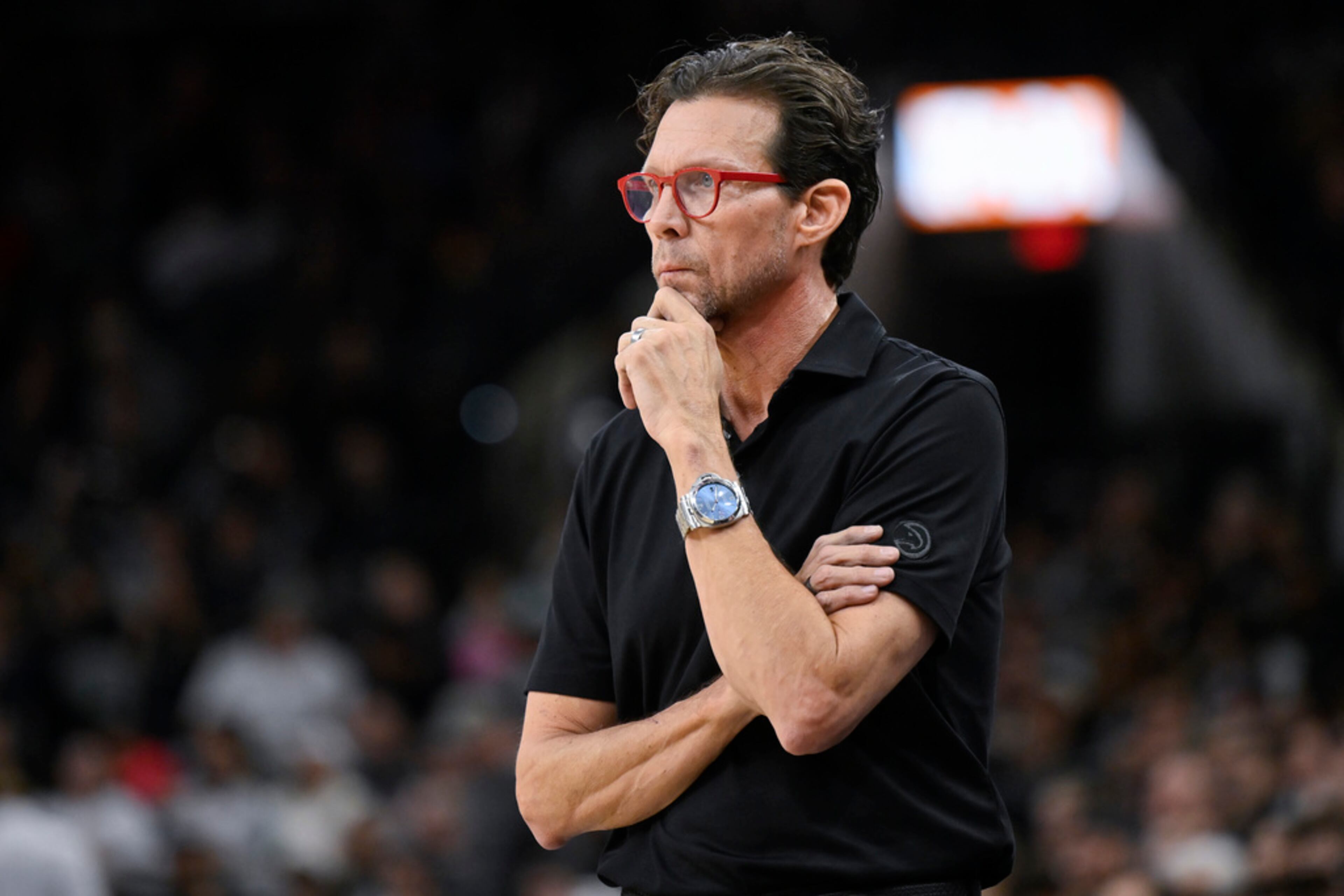 Atlanta Hawks coach Quin Snyder watches play during the second half of the team's NBA basketball game against the San Antonio Spurs, Thursday, Nov. 30, 2023, in San Antonio. (AP Photo/Darren Abate)