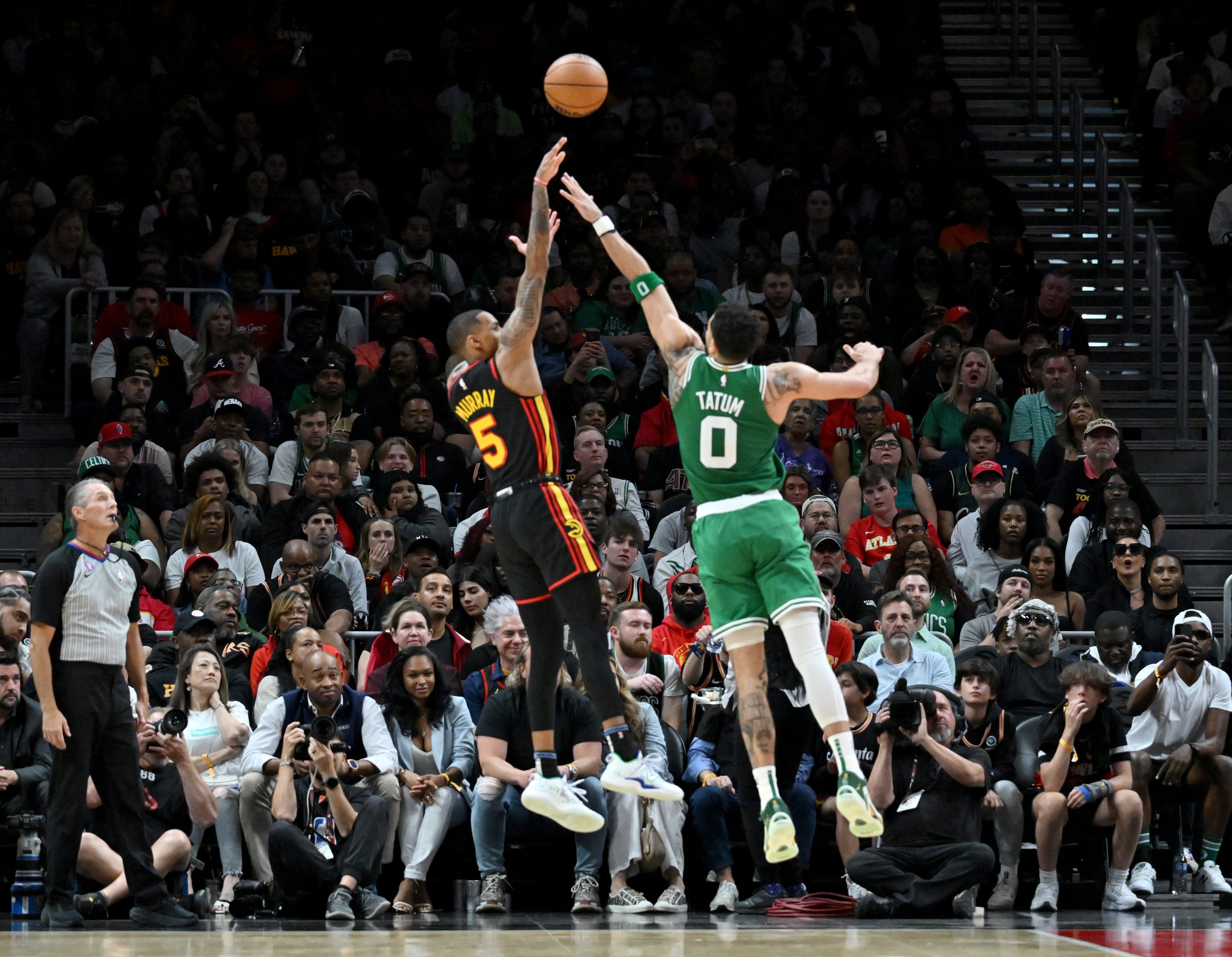 Atlanta Hawks' guard Dejounte Murray (5) shoots over Boston Celtics' forward Jayson Tatum (0) during the second half. (Hyosub Shin / Hyosub.Shin@ajc.com)