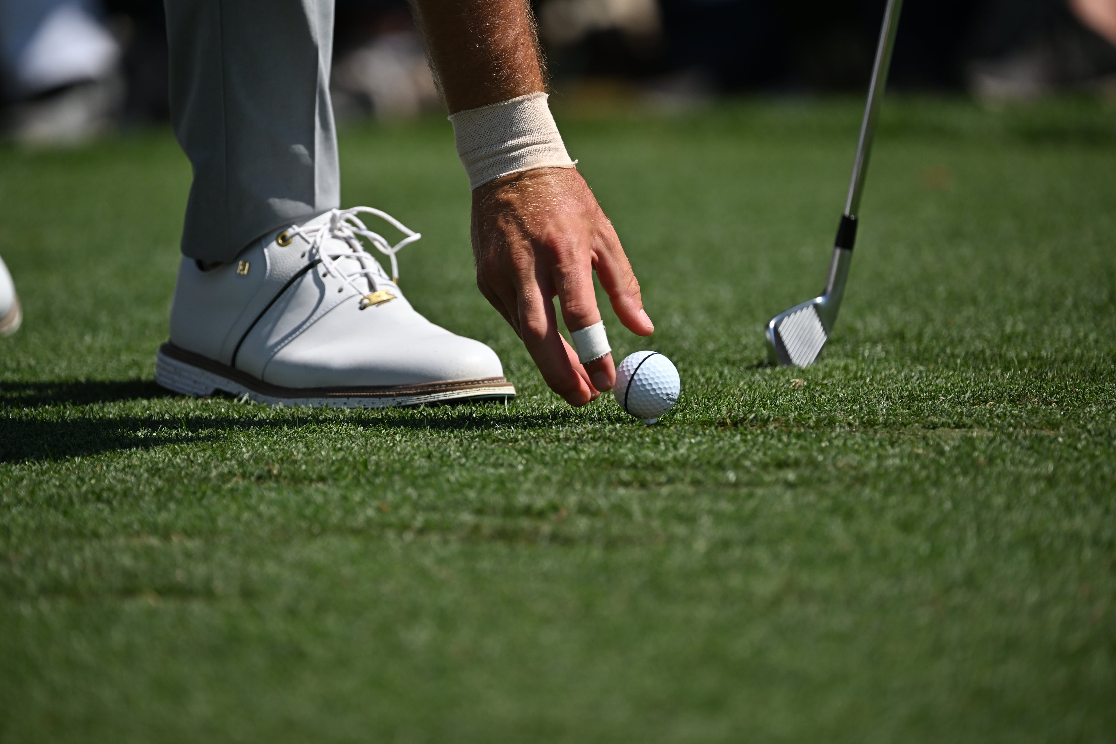 Cameron Young place ball on fourth tee during final round of the Masters, at Augusta National Golf Club, Sunday, April 12, 2026, in Augusta, GA (Hyosub Shin/AJC)