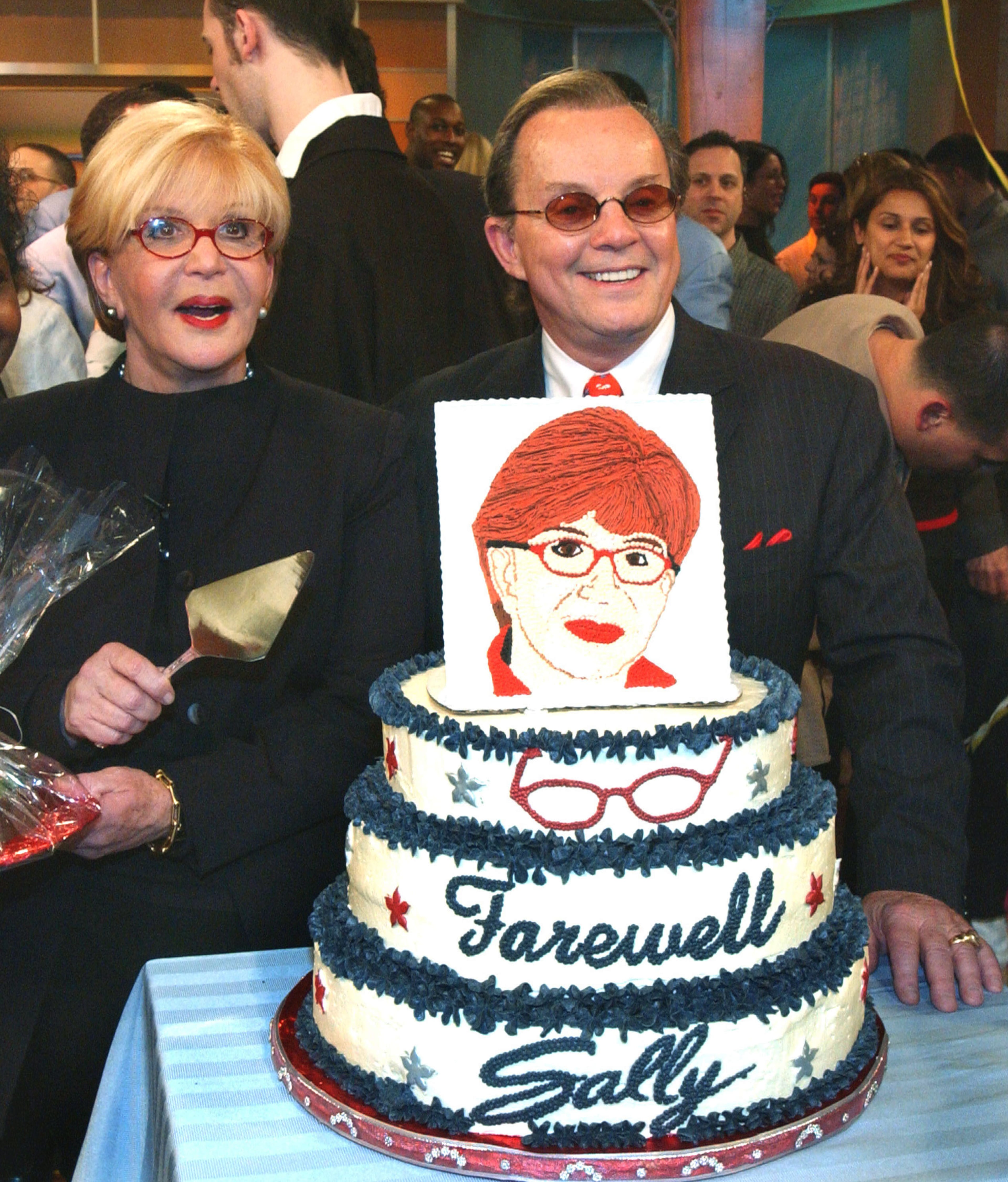 404446 01: Talk show host Sally Jesse Raphael (L) and her husband Karl Soderlund prepare to cut her cake, celebrating the taping of her last show April 24, 2002 in New York City. Her last show will air this May. (Photo by Jim Lord/Getty Images)