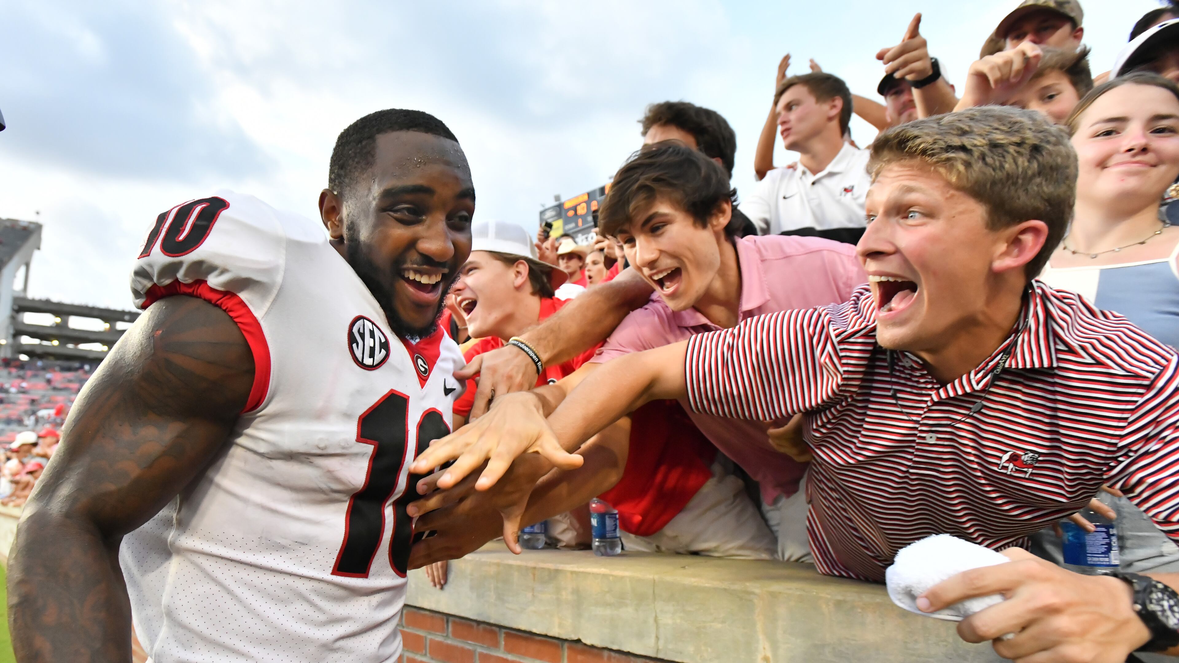 October 9, 2021 Auburn, Georgia wide receiver Kearis Jackson (10) celebrates with fans after Georgia defeat Auburn in an NCAA college football game at Jordan–Hare Stadium in Auburn, Alabama on Saturday, October 9, 2021. Georgia won 34-10 over Auburn. (Hyosub Shin / Hyosub.Shin@ajc.com)