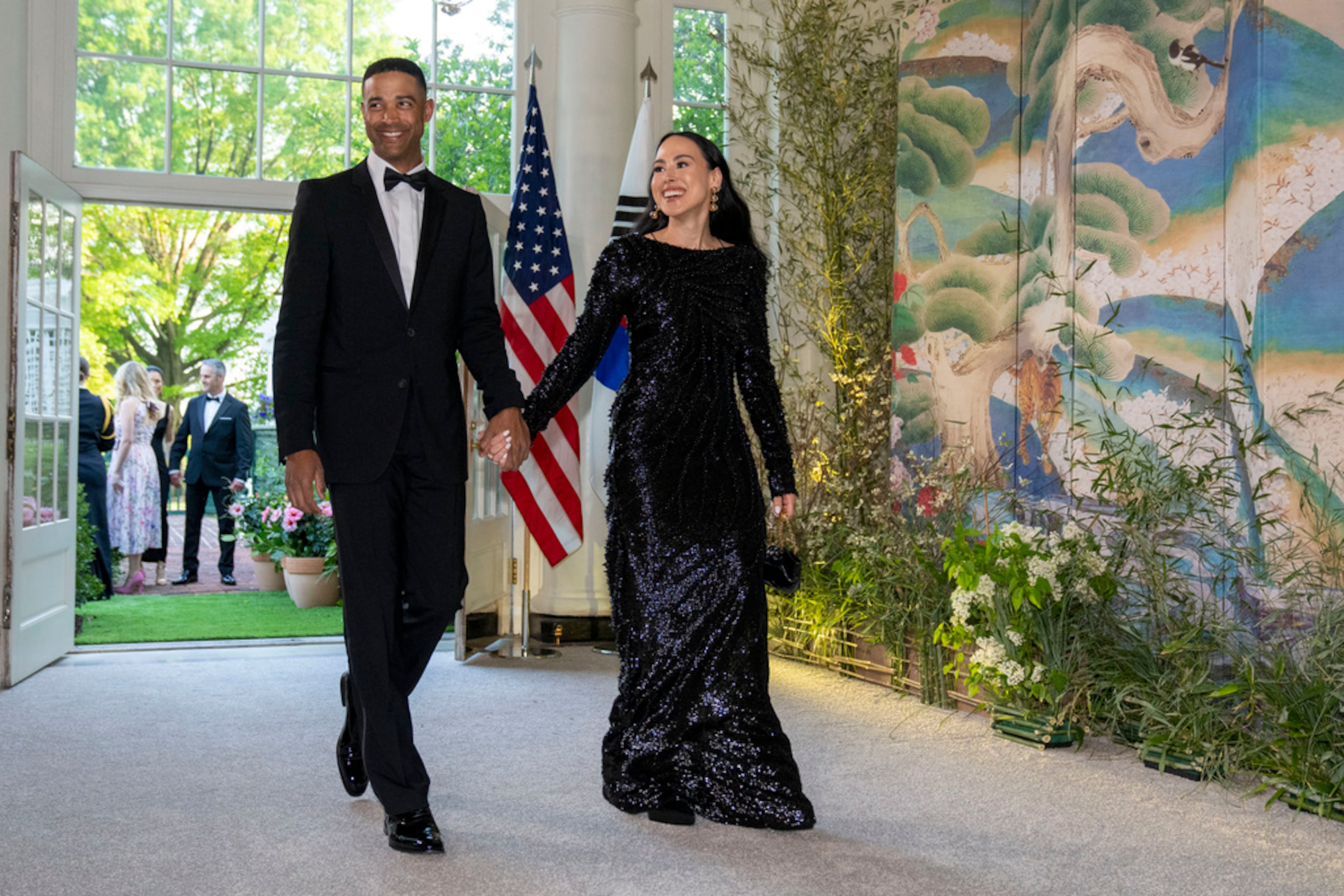 Nikolas Ajagu, left, and Meena Harris arrive for the State Dinner with President Joe Biden and the South Korea's President Yoon Suk Yeol at the White House, Wednesday, April 26, 2023, in Washington. (AP Photo/Alex Brandon)