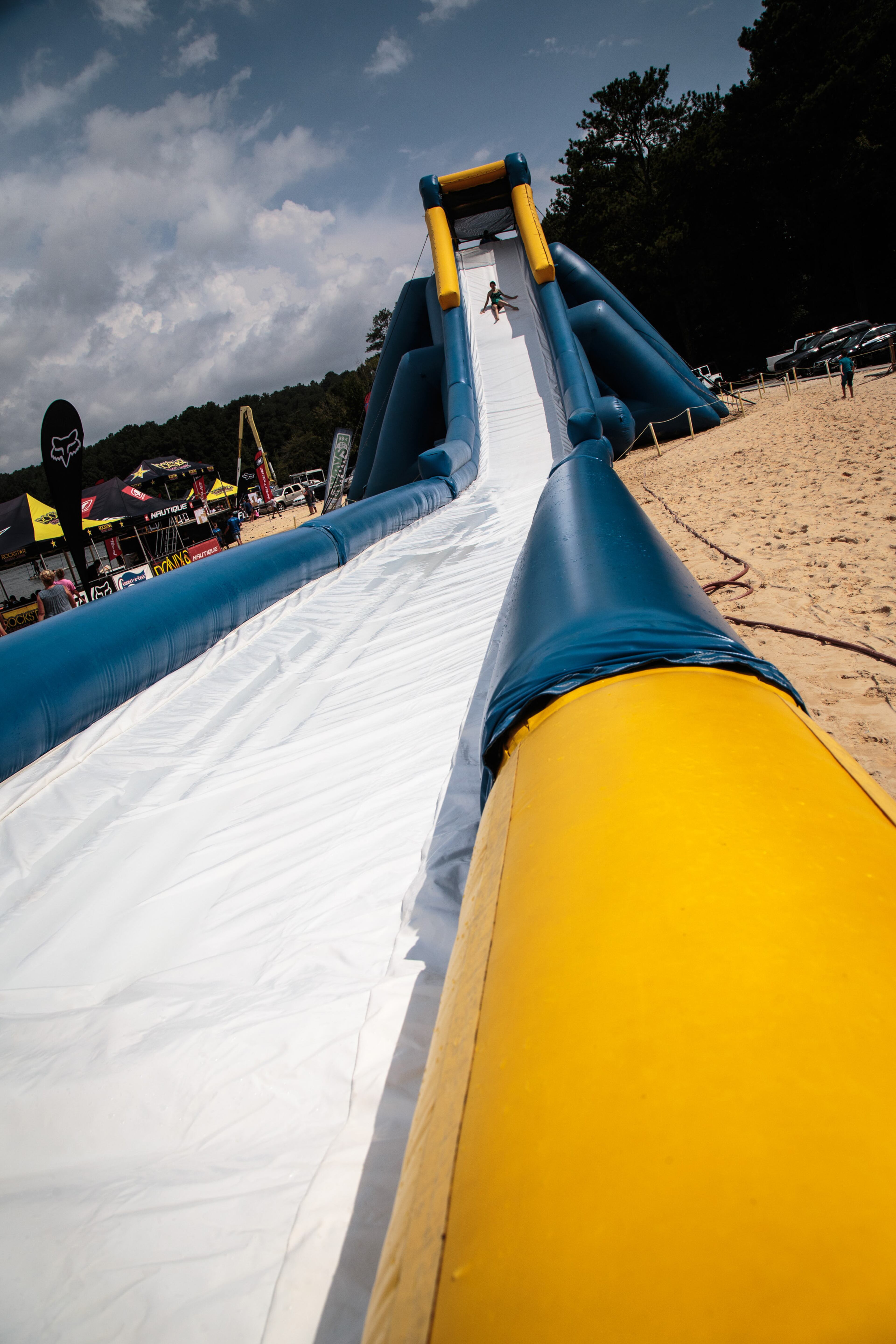 Amada Sheurman heads down the Acworth Slide at Dallas Landing Park in Acworth, Ga. Saturday, July 30, 2016. The 175' long and 36-foot high water slide is billed as the world's largest inflatable slide. STEVE SCHAEFER / SPECIAL TO THE AJC