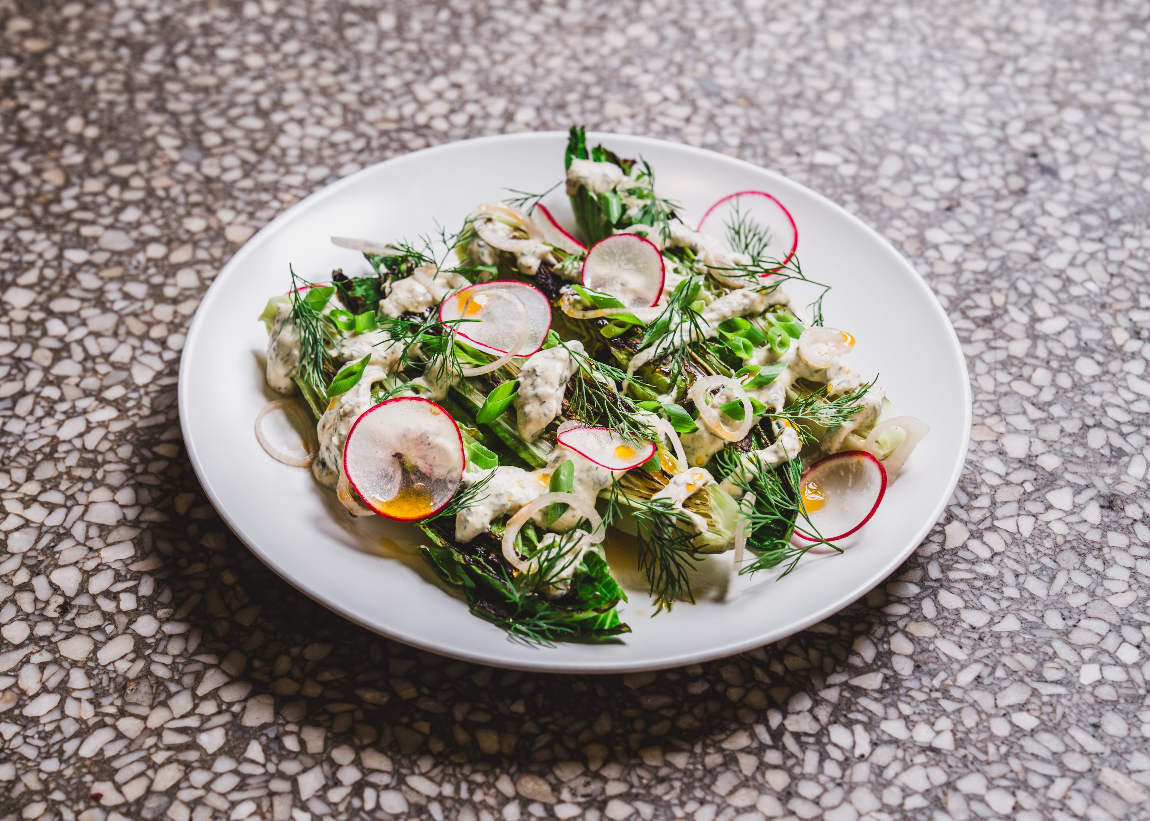 The tender greens from So. Fox include kohlrabi, radish, creme fraiche and shallot. (Courtesy of Dave Crawford)