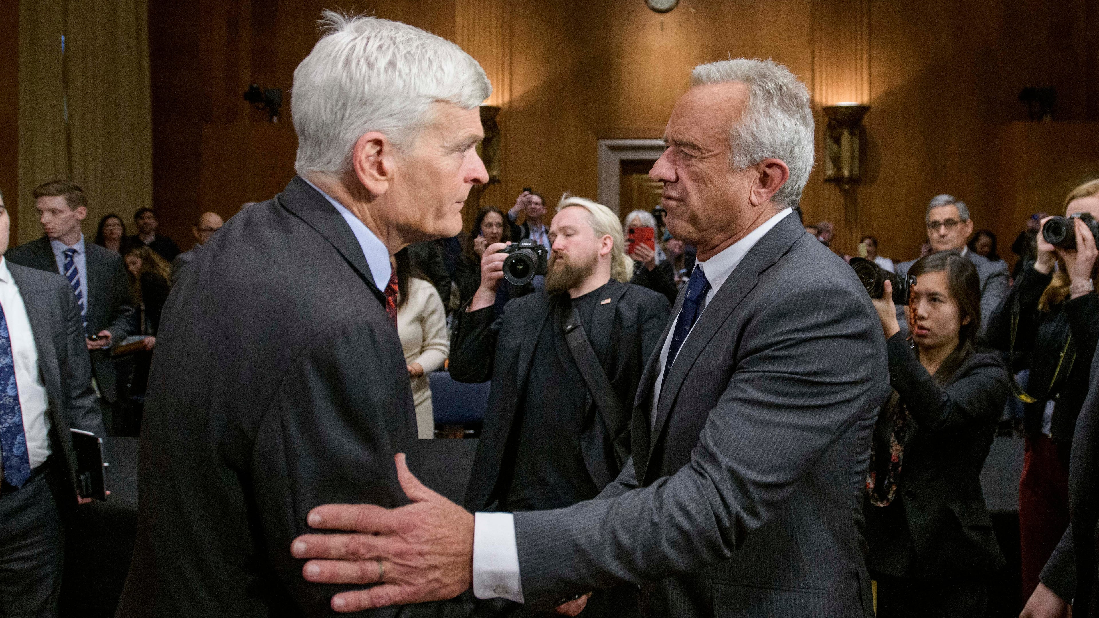 FILE - Robert F. Kennedy, Jr., right, President Donald Trump's nominee to serve as Secretary of Health and Human Services, talks with Committee Chairman Sen. Bill Cassidy, R-La., following his confirmation hearing on Capitol Hill, Jan. 30, 2025, in Washington. (AP Photo/Rod Lamkey, Jr., File)