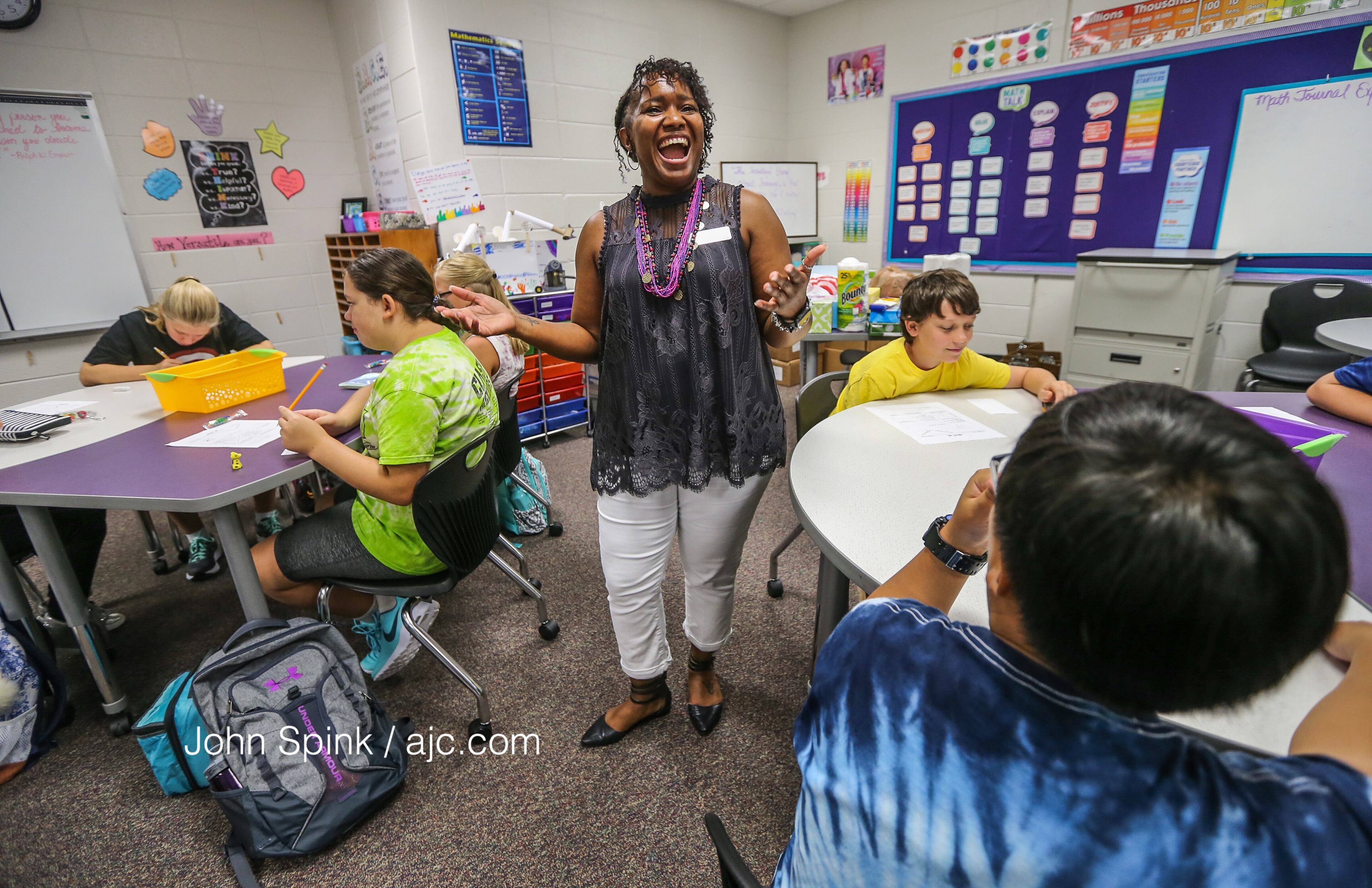August 7, 2017 Lithonia; Fifth grade student Isaiah Brown, 10, enjoys the freedom of an open hallway as he is the first student to arrive for the first day of school at Edward L Bouie Elementary School on Monday, August 7, 2017, in Lithonia. Curtis Compton/ccompton@ajc.com