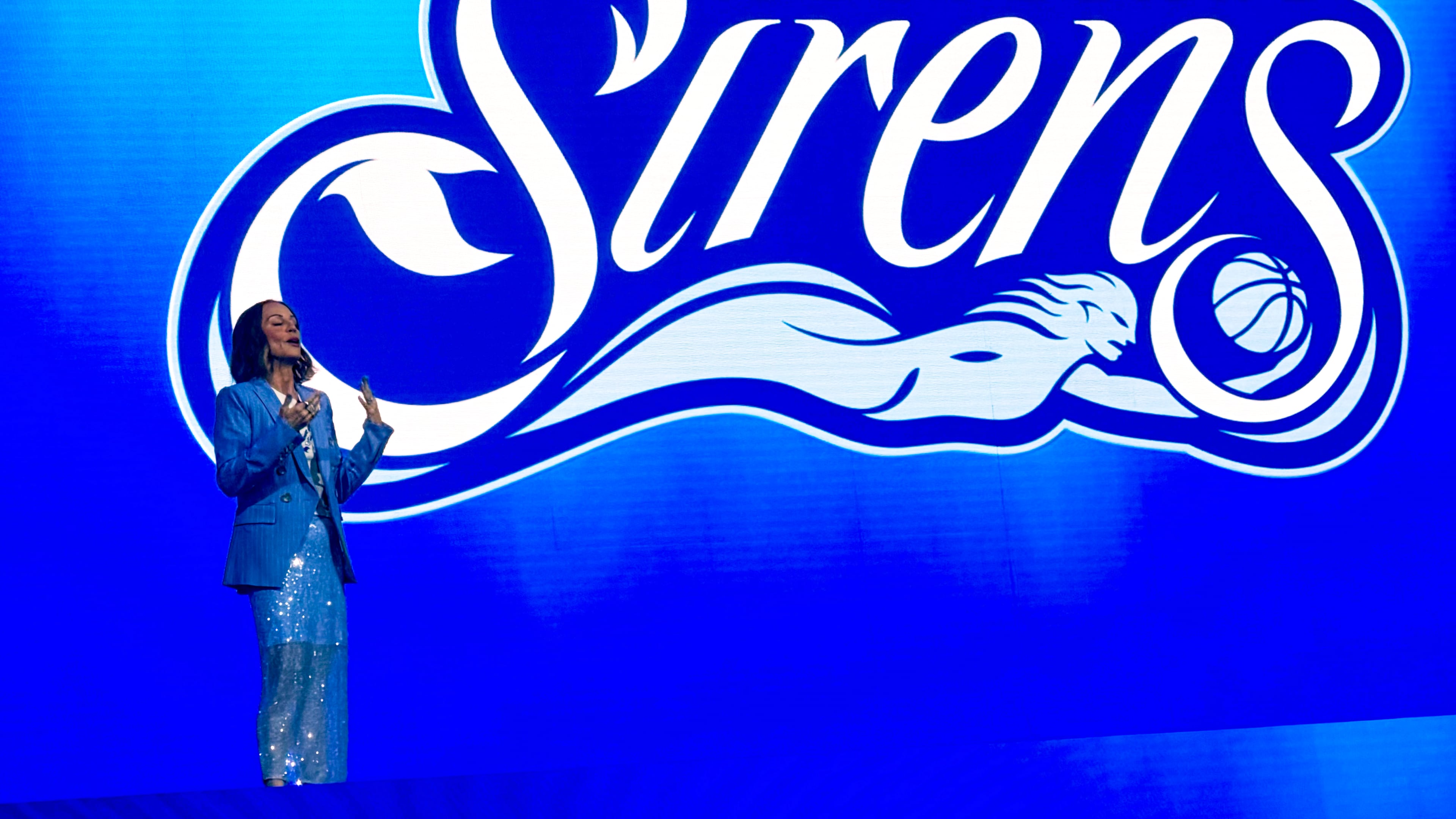 Cleveland Sirens President of Business Operations Allison Howard introduces the name of Cleveland’s WNBA franchise during an event at Rocket Arena, Tuesday, Aug. 4, 2026, in Cleveland. (AP Photo/Joe Reedy)