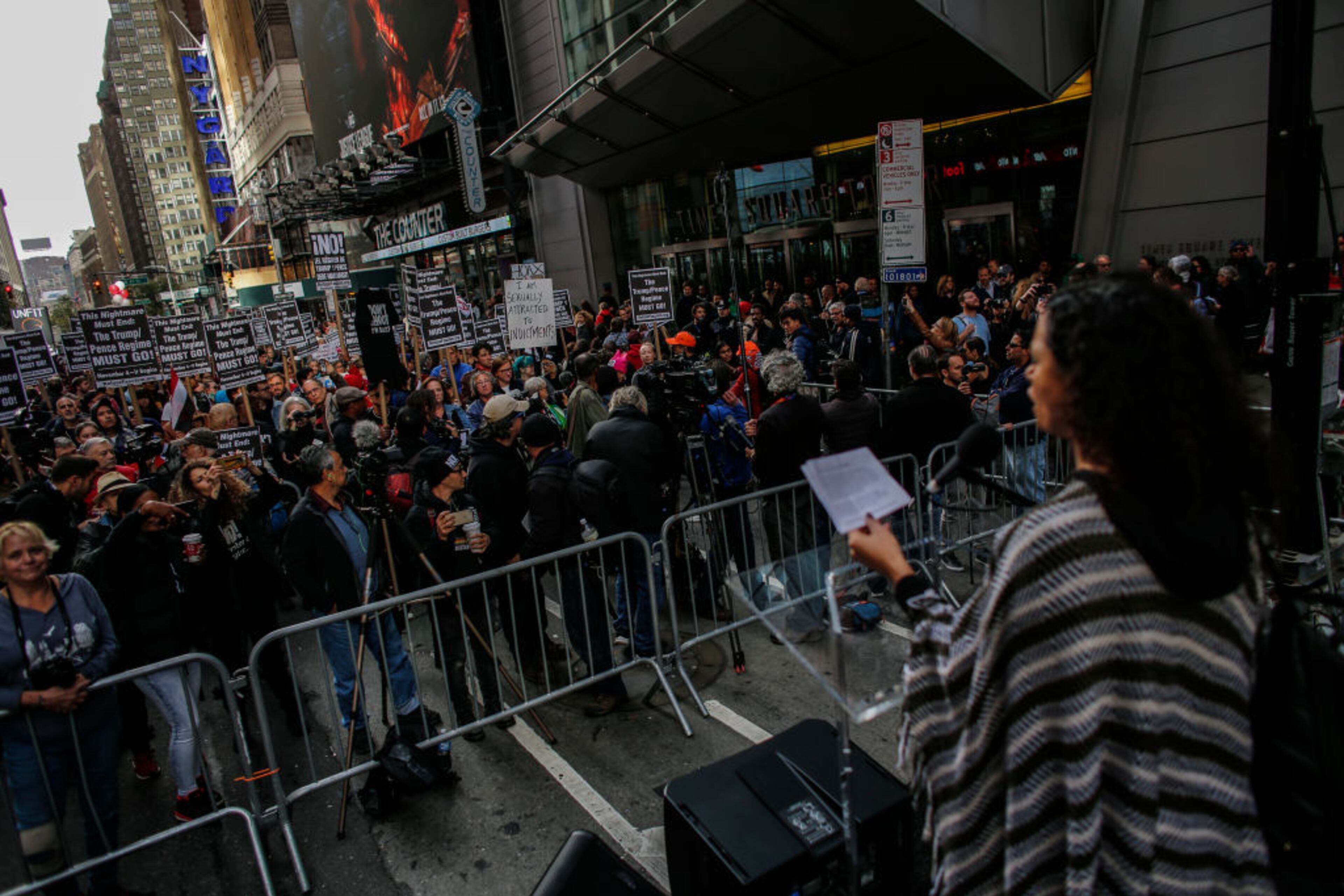 NEW YORK, NY - NOVEMBER 04: A speaker stands on stage as she takes part in a nationwide protest against the Trump administration in Times Square on November 4, 2017 in New York City. Anti-Trump protests are scheduled for major cities across the country today including New York, Chicago and Los Angeles. (Photo by Kena Betancur/Getty Images)