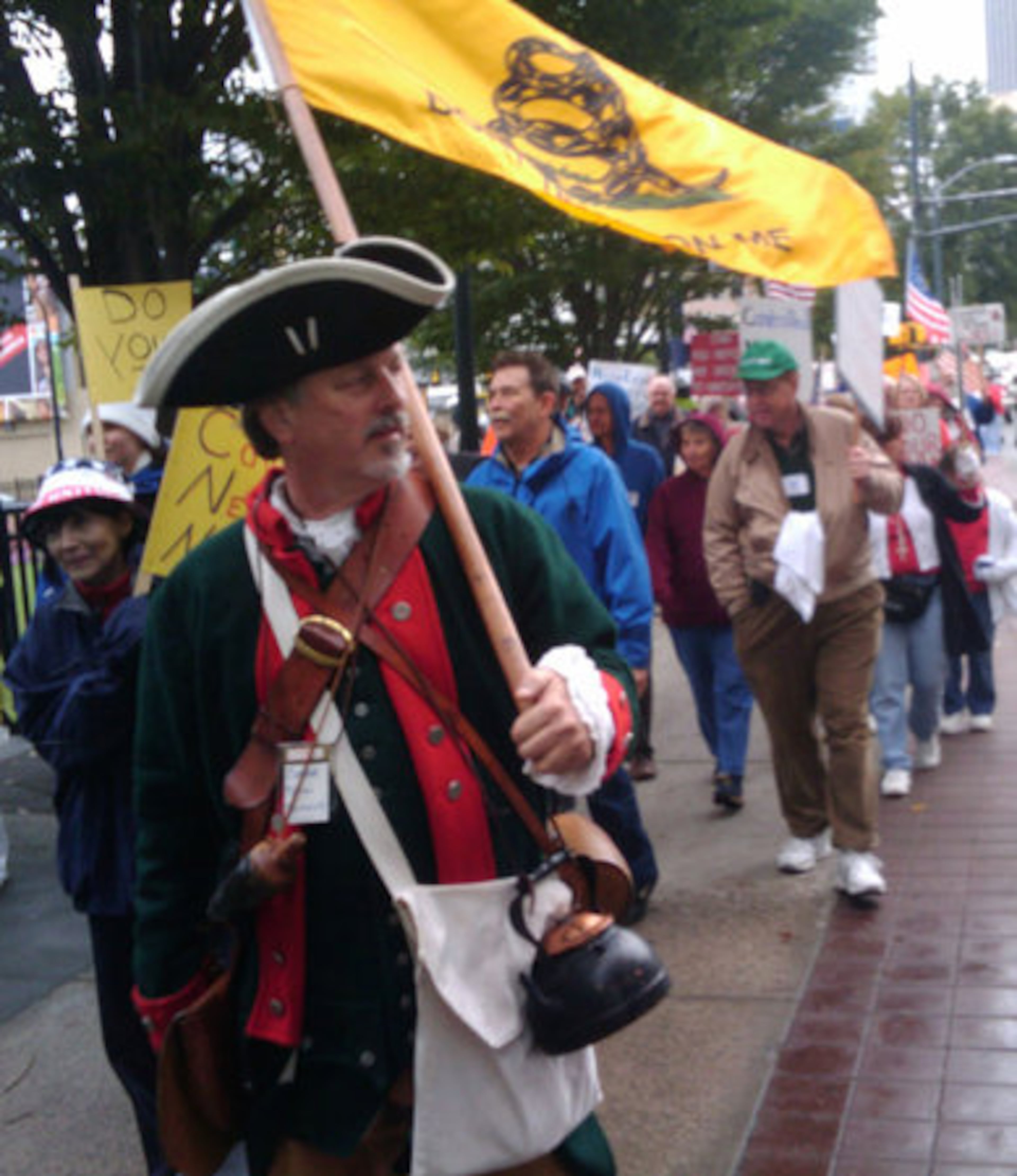 Though the protest was not organized by "Tea Party" conservatives, many in the crowd were obviously members of that group too, including this man who dressed as a Minuteman and wore a tea pot.