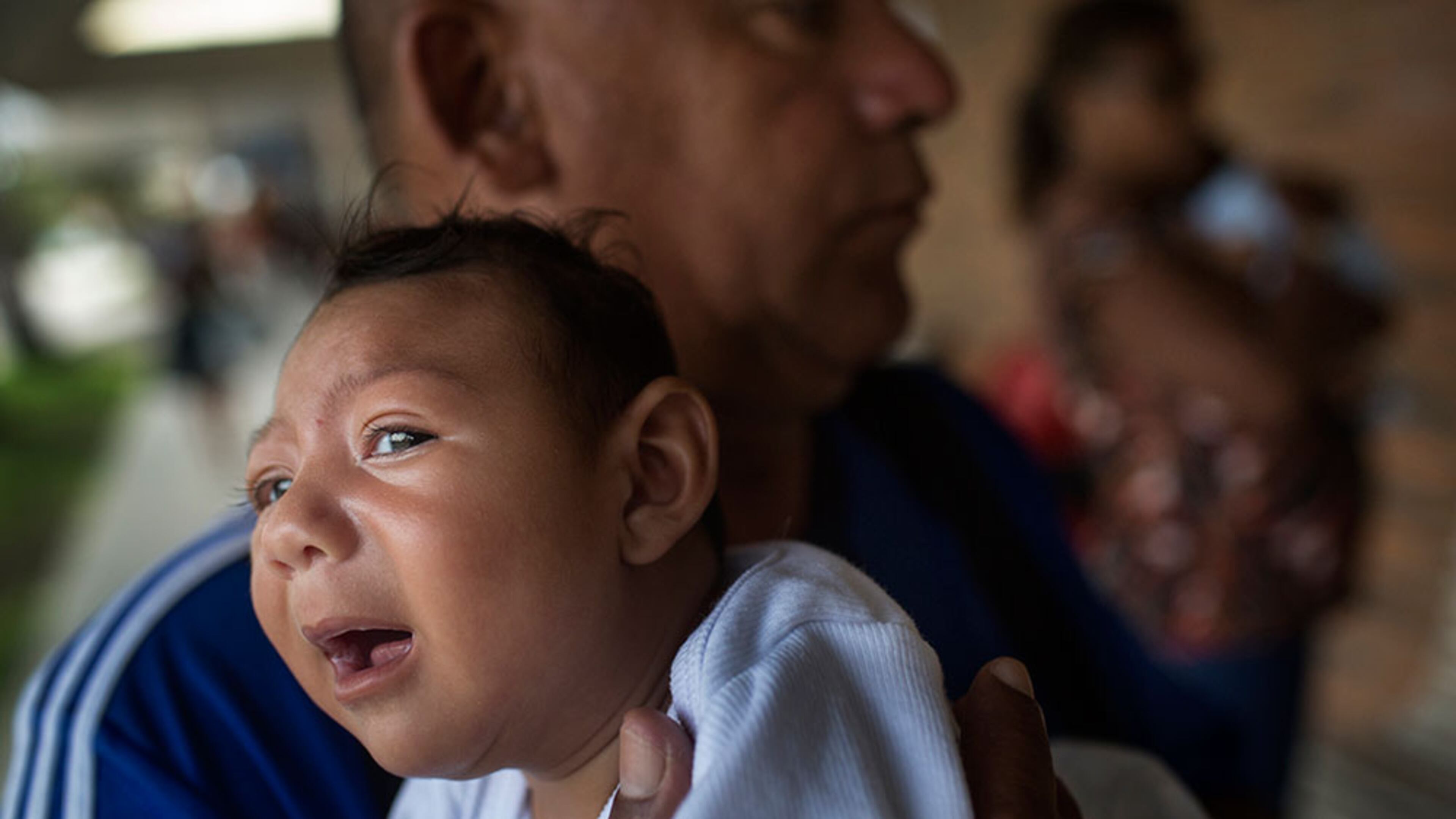 AP SYNDV-ZIKA-012716-AP Joao Batista holds his one-month-old daughter Alice Vitoria in his arms in Recife, Brazil, 21 January 2016. The baby suffers from microcephaly, which manifests in an unusually small head circumference and impaired brain function. The Zika virus transmitted by mosquitos to pregnant women is suspected of causing these issues. Brazil alone is reporting nearly 3900 cases. Photo by: Rafael Fabres/picture-alliance/dpa/AP Images