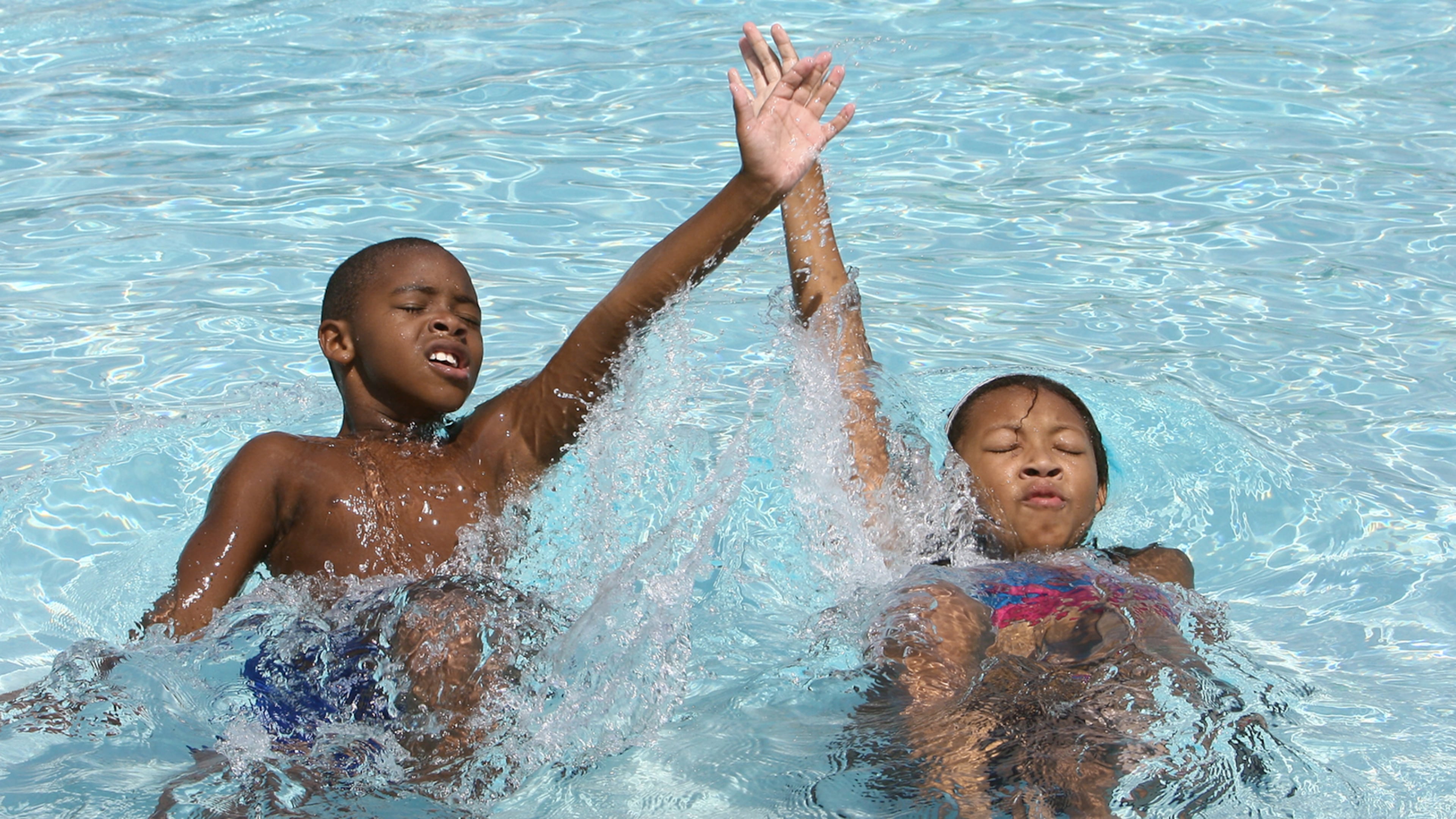 Marcus Lazenberry, left, age 7, and his sister Kristen Lazenberry, right, age 11, of Duluth do the backstroke in the pool at the West Gwinnett Aquatic Center in Norcrossin 2008. Kimberly Smith/ ksmith@ajc.com