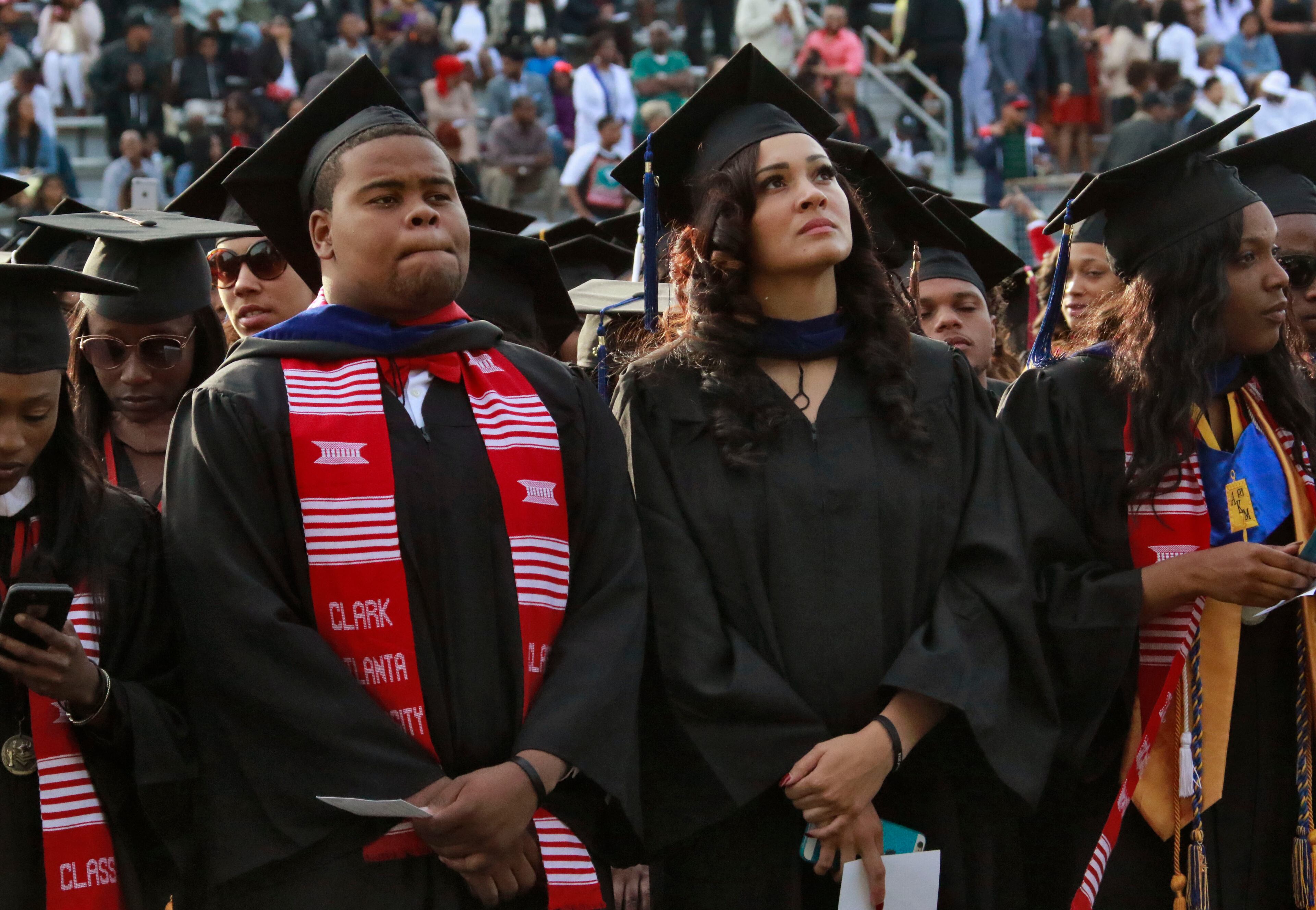 May 16, 2016 - Atlanta - Graduates stand as the class of 2016 processes in. Clark Atlanta University class of 2016 filled Panther Stadium Monday morning for it's 27th annual Commencement Service. The keynote speaker was retired astronaut Mae Jemison, the first woman of color in Space. Honorary degrees were awarded to Hamilton Bohannon, a 1964 graduate of Clark College; Roland Carter; Congressman John Conyers, and Congressman Hank Johnson, a 1976 Clark College graduate. BOB ANDRES / BANDRES@AJC.COM