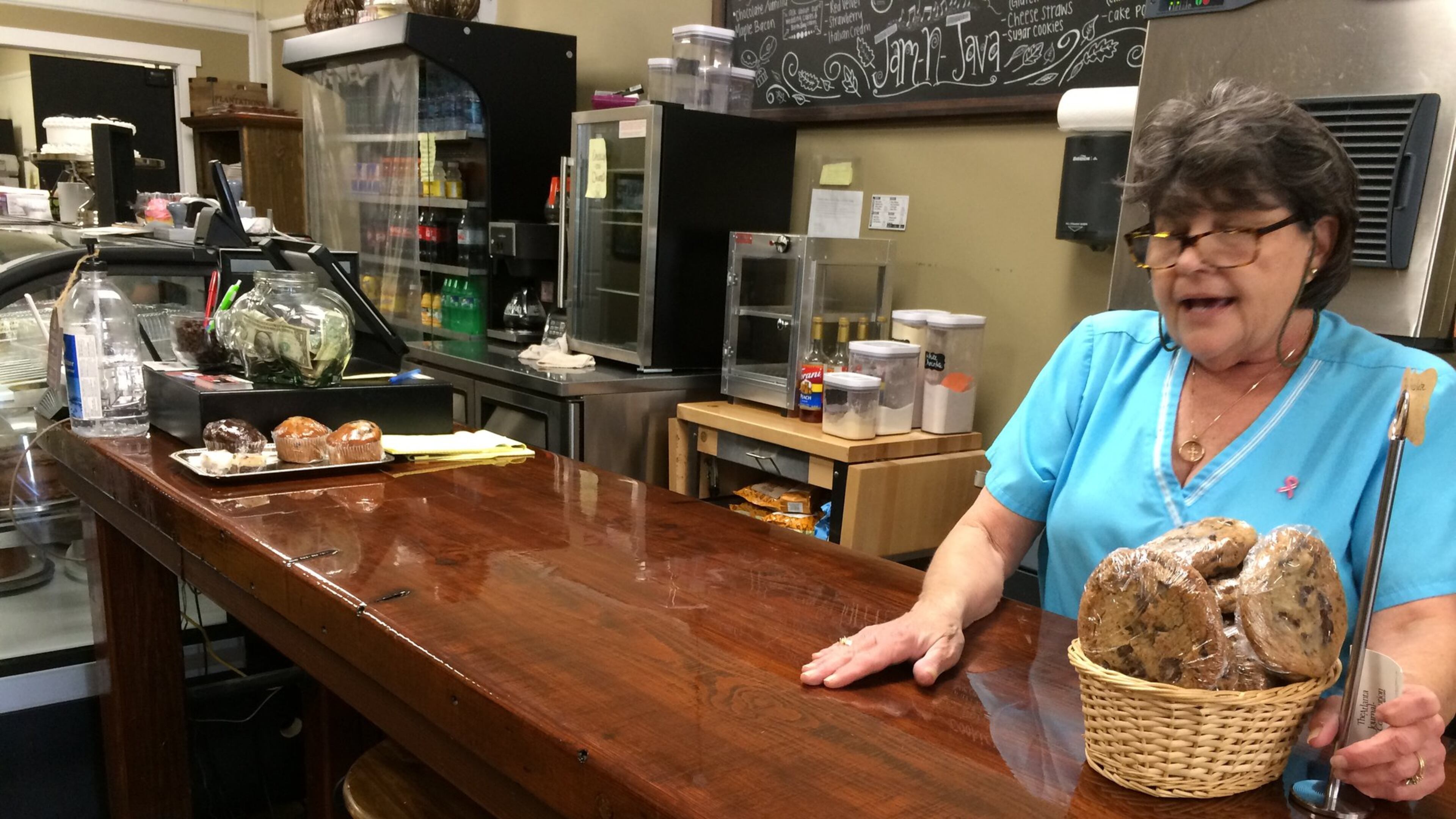 Rebba Storey works at the counter of the Jam-N-Java Bakery and Coffeehouse in West Point. The counter used to be part of Lanett Mill, a textile mill that has long since shut down. The textile industry was on a downturn before the North American Free Trade Agreement took effect, but the trade pact dealt one of the final blows. “We came to work one day and the gate was locked,” said Storey, who was a human resources manager at another mill. “No notice, no checks, no severance.”
