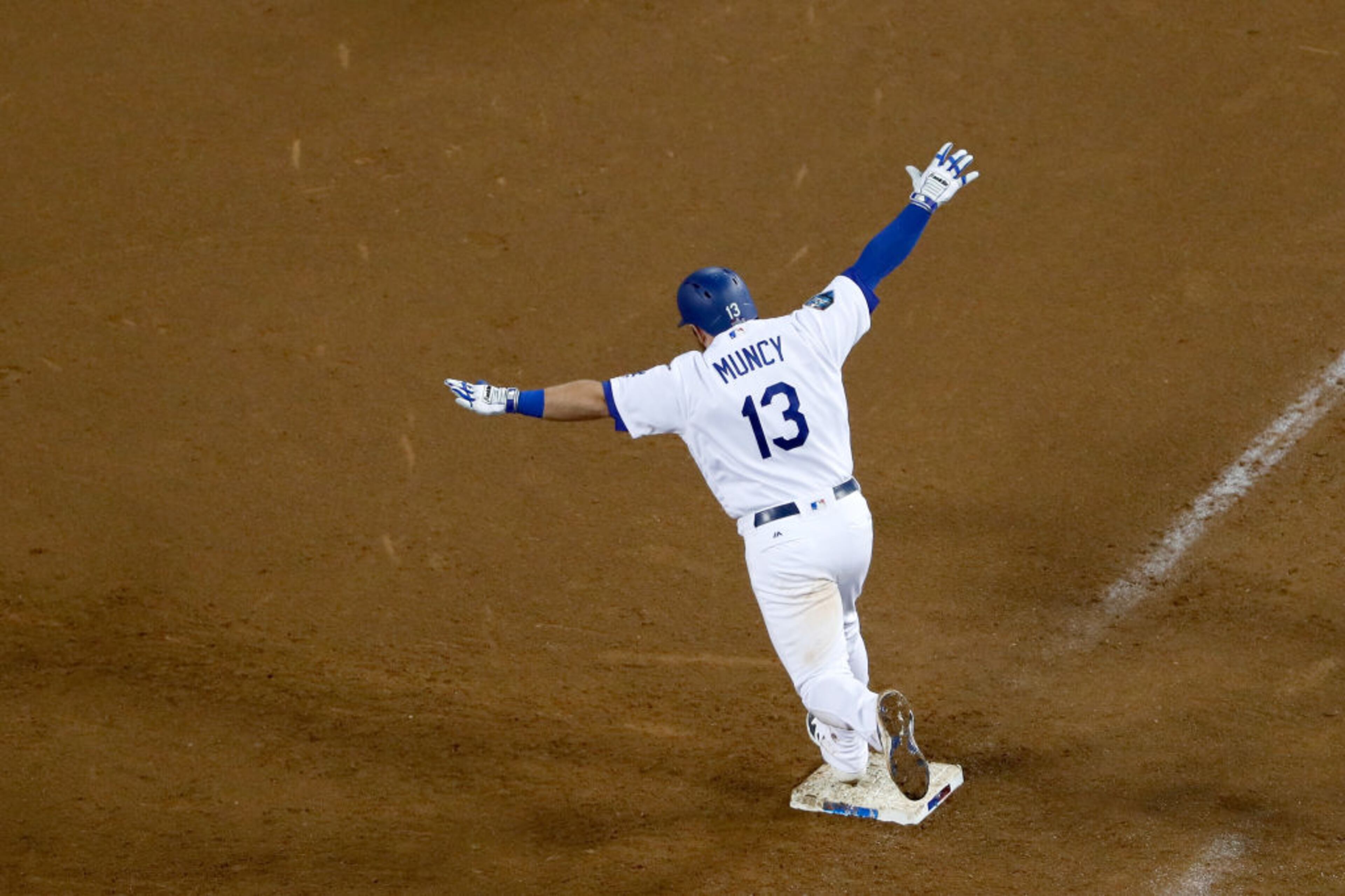 LOS ANGELES, CA - OCTOBER 26: Max Muncy #13 of the Los Angeles Dodgers celebrates his eighteenth inning walk-off home run to defeat the the Boston Red Sox 3-2 in Game Three of the 2018 World Series at Dodger Stadium on October 26, 2018 in Los Angeles, California. (Photo by Sean M. Haffey/Getty Images)