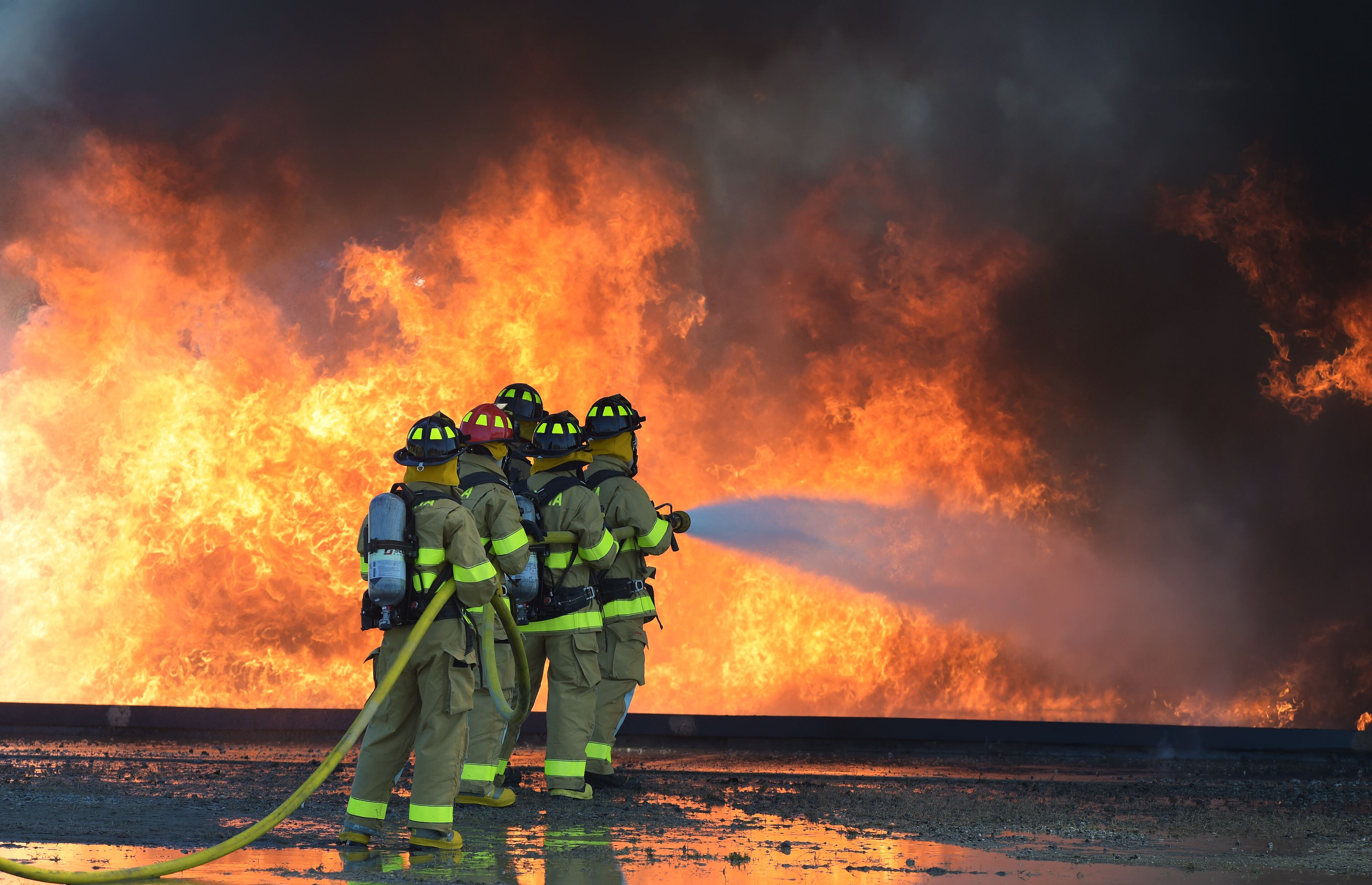 SEPTEMBER 14, 2015 ATLANTA Atlanta Fire Rescue Department firefighters hosted live fire training for attendees at the Aircraft Rescue Fire Fighting (ARFF) Conference, Monday, September, 14, 2015. Firefighters from across the world, battled a simulated fire in an engine and landing gear and also a cascade fire with wing and fuel tanks. Firefighters were Atlanta this week for the 26th Annual ARFF Working Group Conference and Educational Symposium. One of the highlights of the conference was the live fire training at the Hartsfield-Jackson firefighter training site. KENT D. JOHNSON/KDJOHNSON@AJC.COM