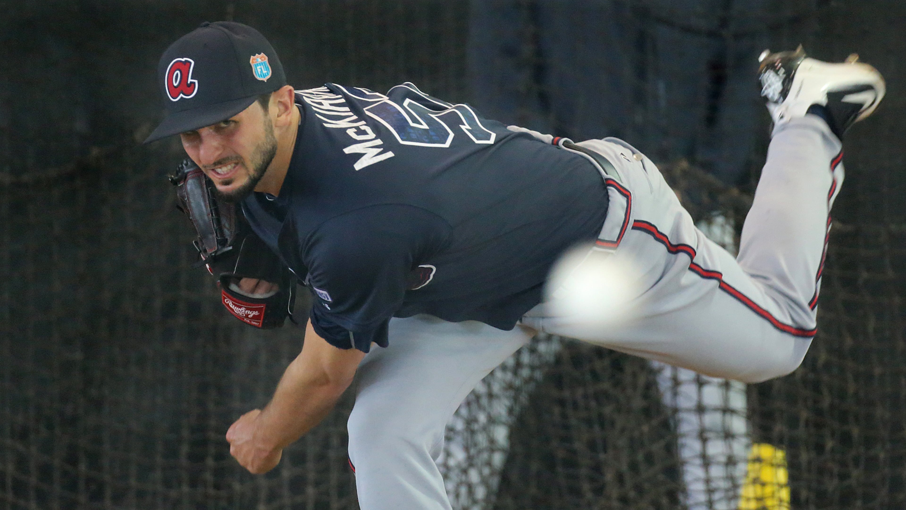 022416 LAKE BUENA VISTA: Braves pitcher Andrew McKirahan delivers a pitch working in the batting cages on Wednesday, Feb 24, 2016, at the ESPN Wide World of Sports, Lake Buena Vista, FL. Curtis Compton / ccompton@ajc.com