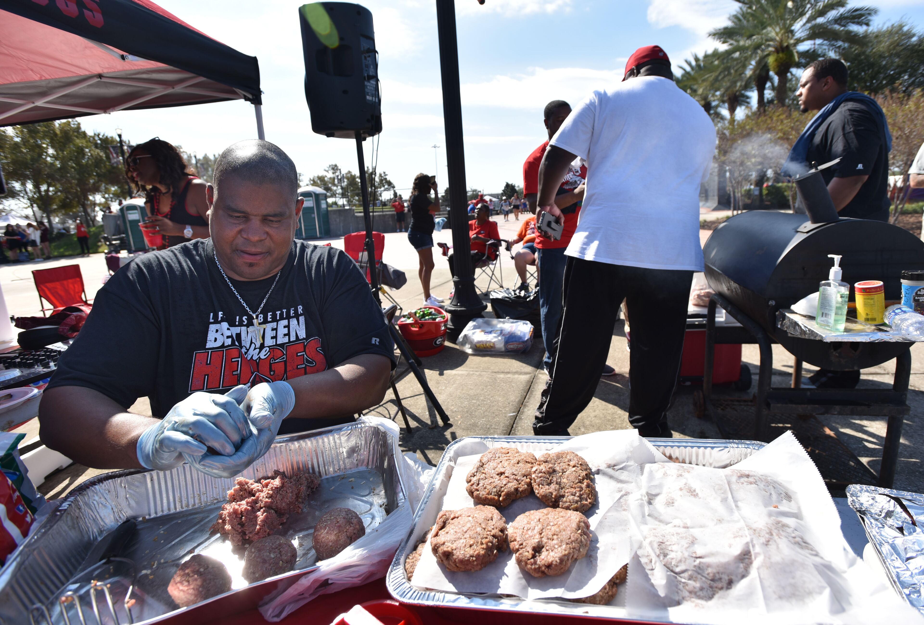Fans tailgate before the start of the Georgia/ Florida matchup Saturday October 31, 2015
