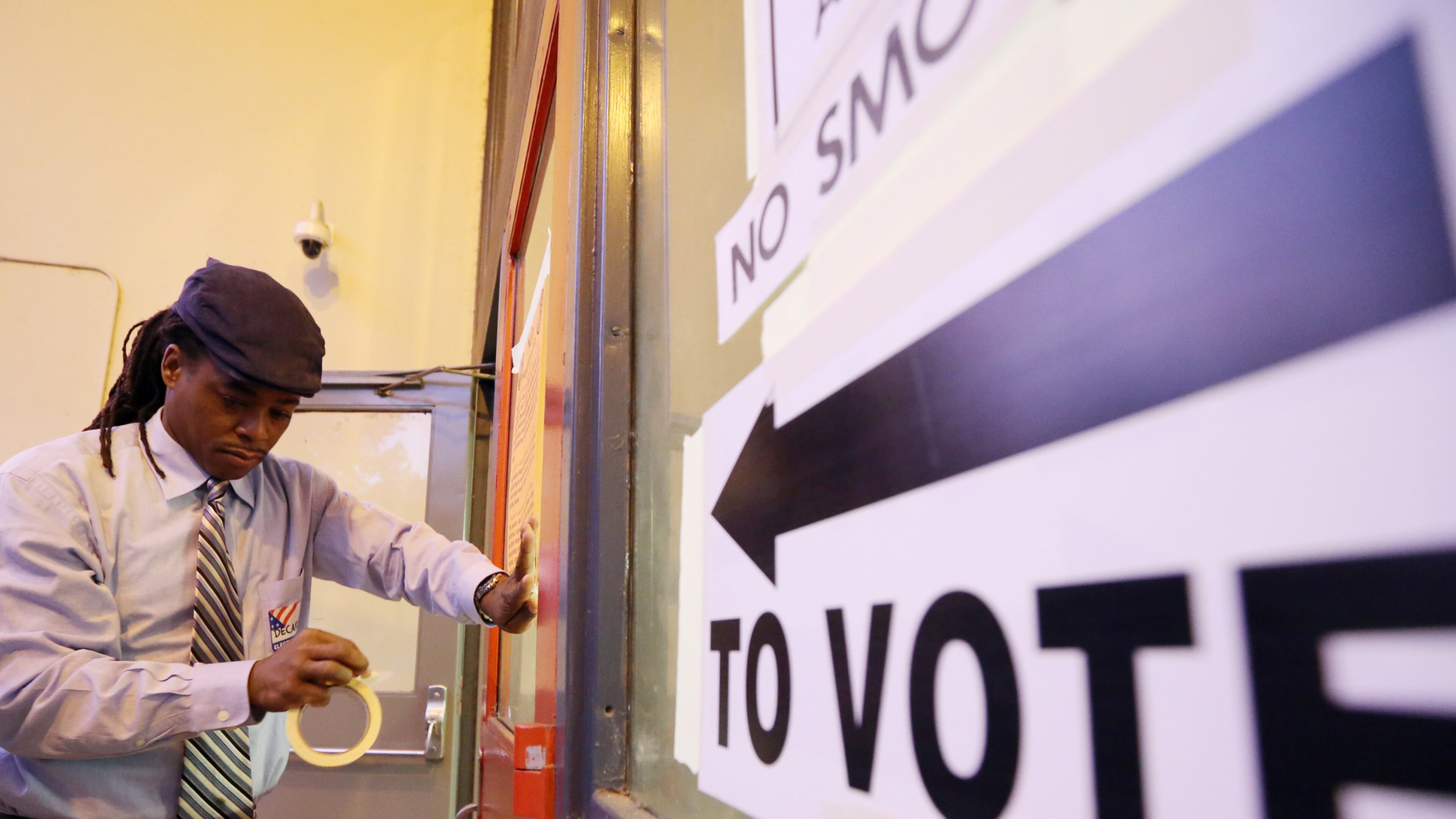 A poll worker sets up for voting just before 7 a.m. Tuesday on Election Day.