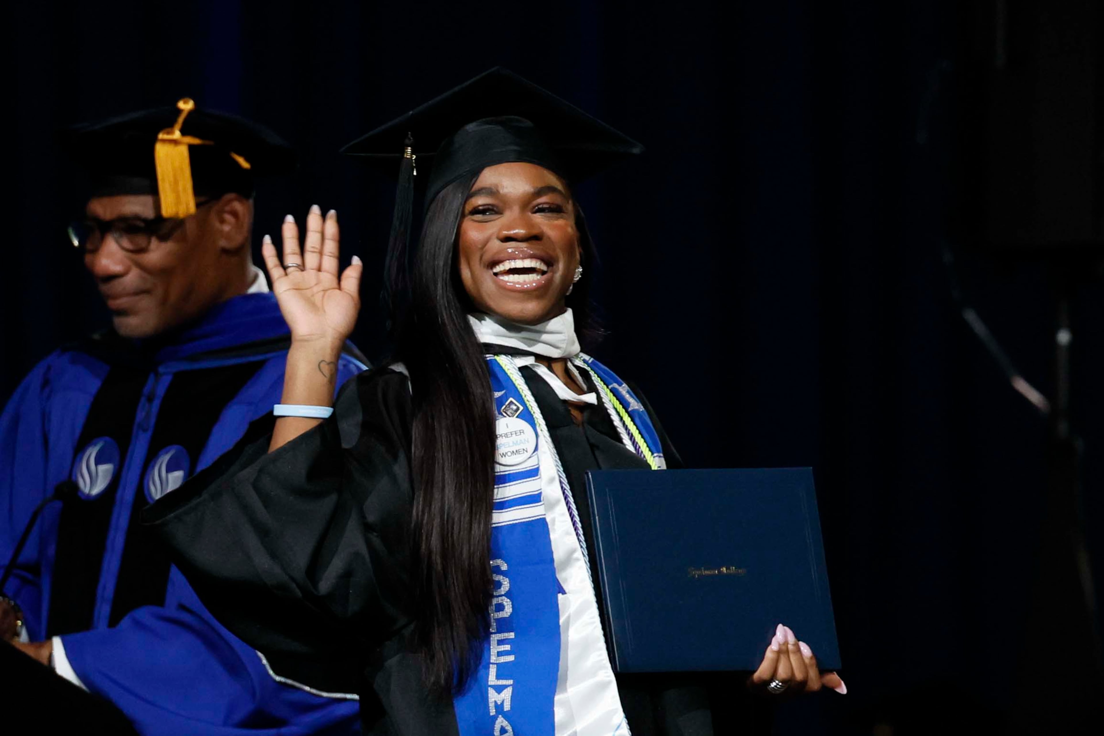 A graduate reacts after receiving her diploma during the Spelman College Commencement at the Georgia International Convention Center in College Park on Sunday, May 17, 2026. (Miguel Martinez/AJC)