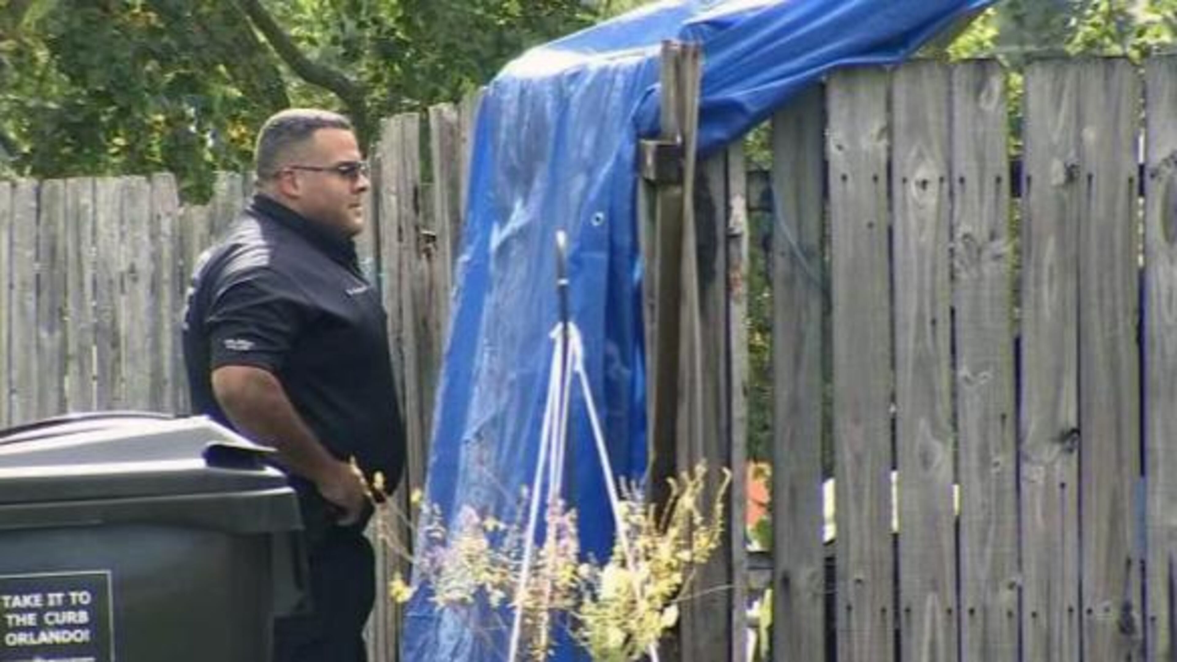 Police investigate the scene where a man's body was found Friday morning.