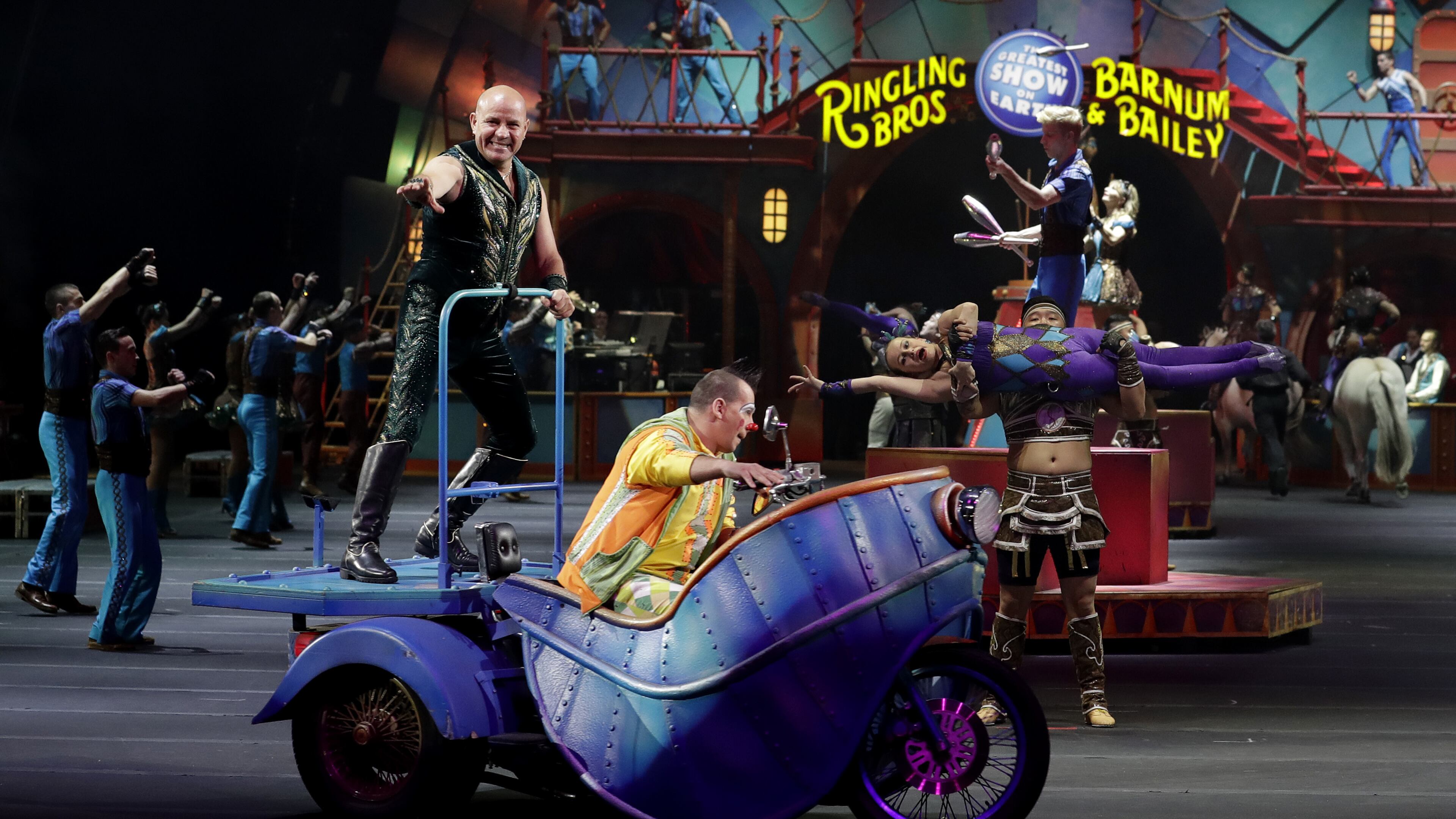 Ringling Bros. and Barnum & Bailey performers begin a show Saturday, Jan. 14, 2017, in Orlando, Fla. The Ringling Bros. and Barnum & Bailey Circus will end the "The Greatest Show on Earth" in May, following a 146-year run of performances. Kenneth Feld, the chairman and CEO of Feld Entertainment, which owns the circus, told The Associated Press, declining attendance combined with high operating costs are among the reasons for closing. (AP Photo/Chris O'Meara)