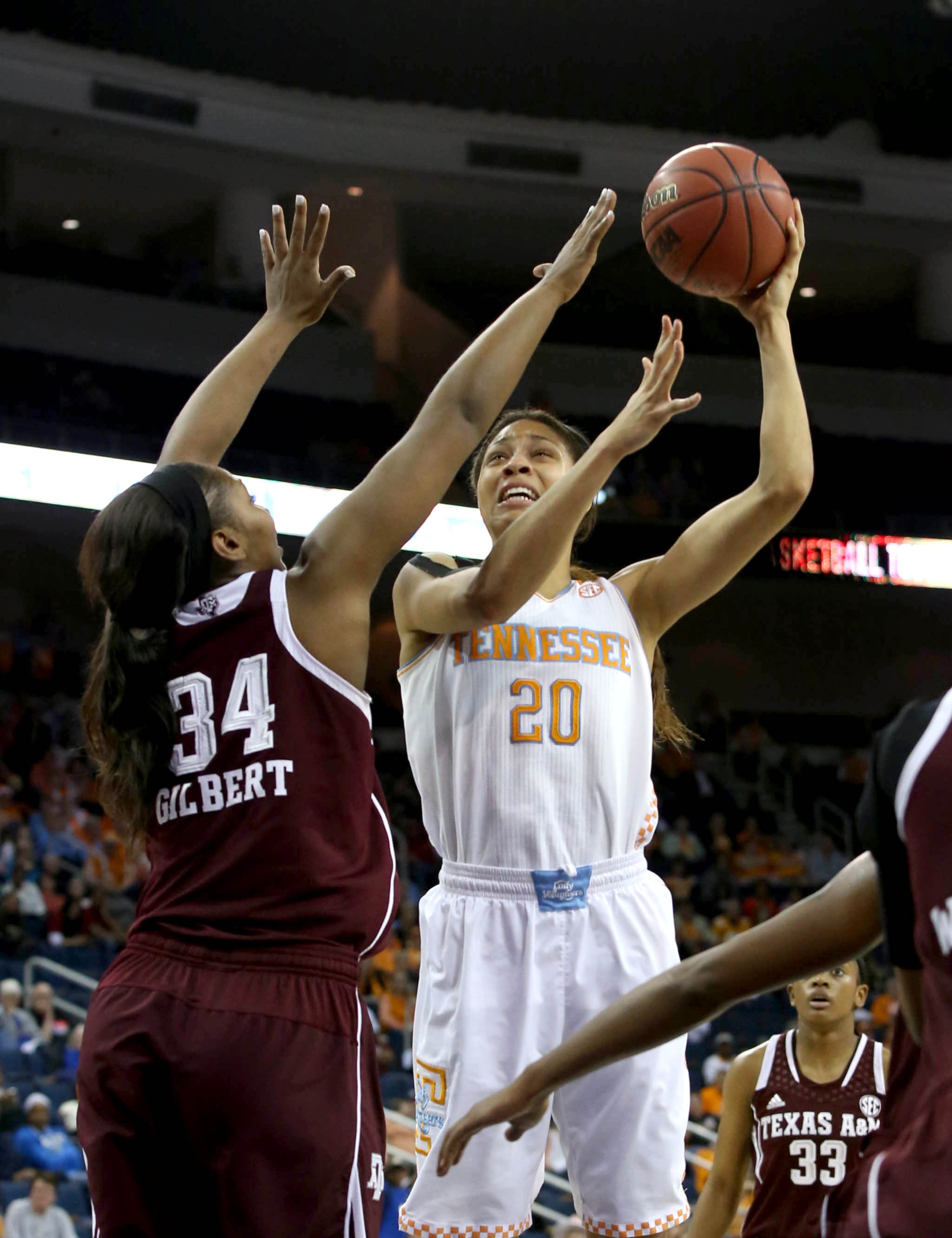 Tennessee center Isabelle Harrison (20) attempts a shot against Texas A&M center Karla Gilbert (34) during Tennessee's win over Texas A&M in the fourth-round of the Women's Southeastern Conference NCAA college basketball game, Saturday, March 8, 2014, in Duluth, Ga. (AP Photo/Jason Getz)