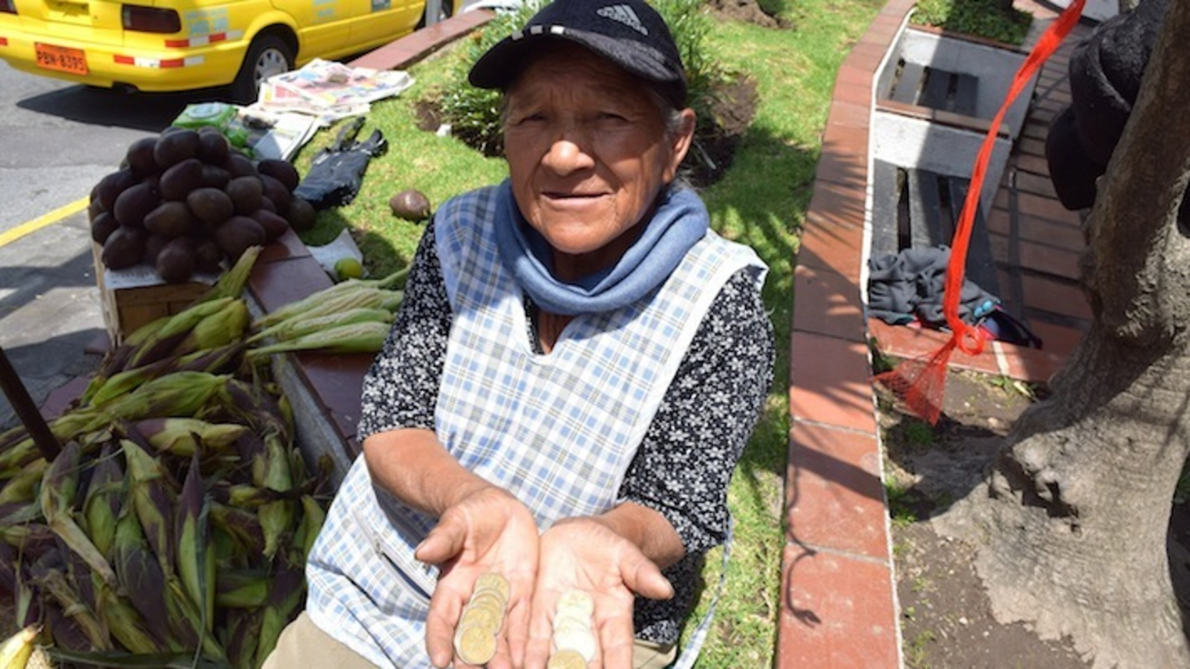 Luzmila Mita holds Sacagawea dollar coins in Quito, Ecuador. Sacagawea, an 18th Century Shoshone tribeswoman, is seen as something of a kindred spirit in Ecuador. (Jim Wyss/Miami Herald/TNS)